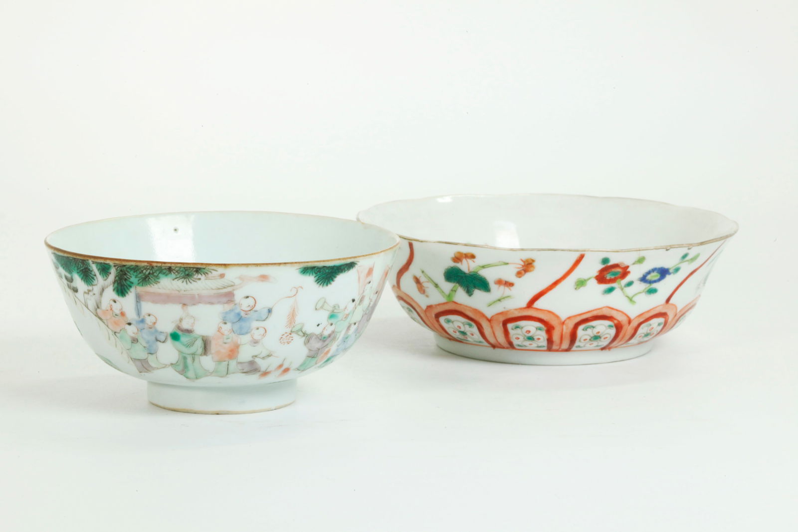 2 Chinese Qing Enameled Porcelain Bowls: 2 Chinese Qing Dynasty Enameled Porcelain Bowls, the larger with flower springs and petal bands with a mark to base in iron red. the smaller with a parade of successful boys and mark to base. Diameter