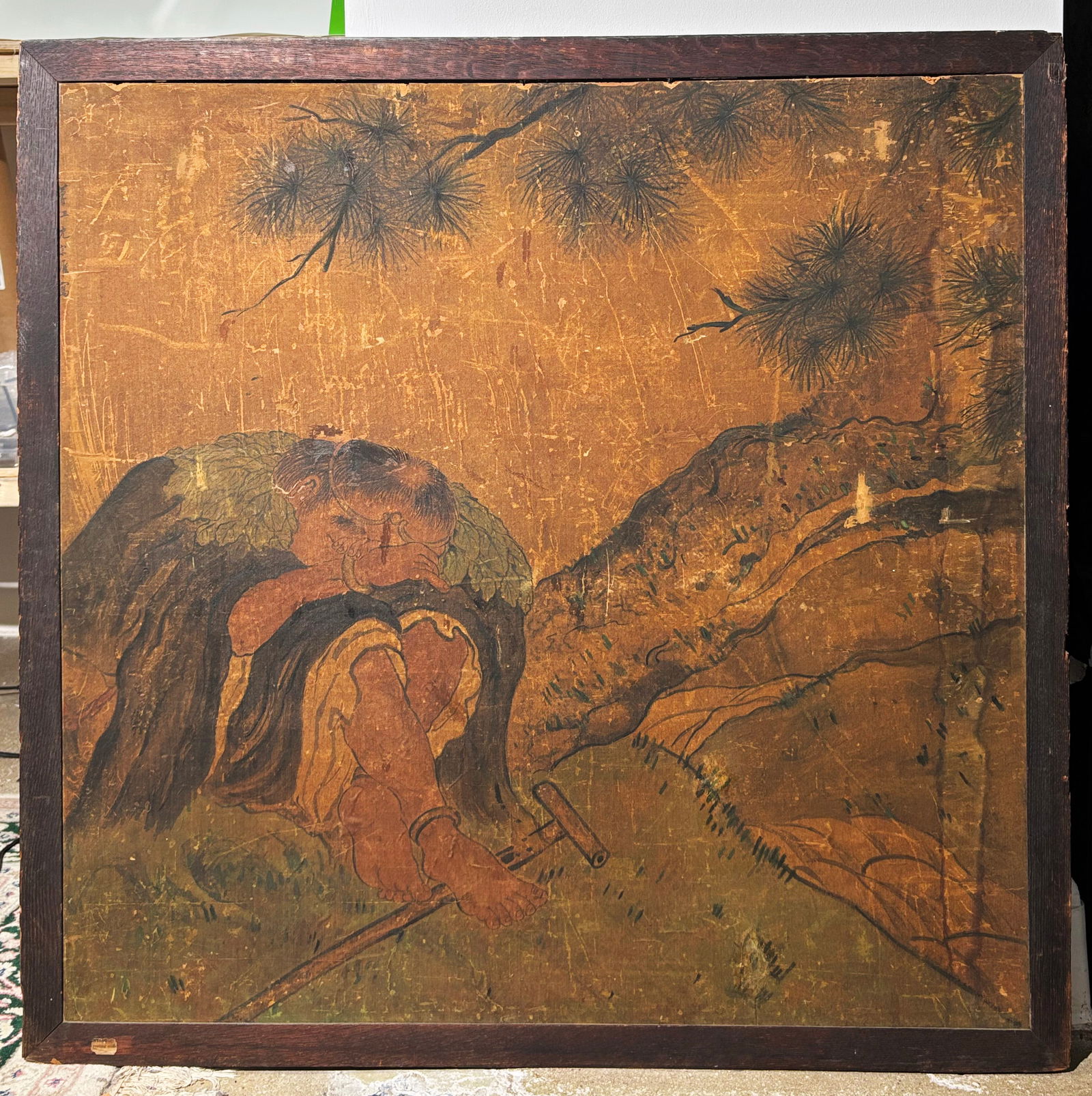 Shen Zongwei: Li Tieguai Under Pine; Ink on Silk: Shen Zongwei: Li Tieguai With Crutch & Double Gourd Resting Under Pine; Ink and Color on silk mounted to board, with a calligraphy inscription to left edge; framed. Height of frame 36 1/4 inches X wid