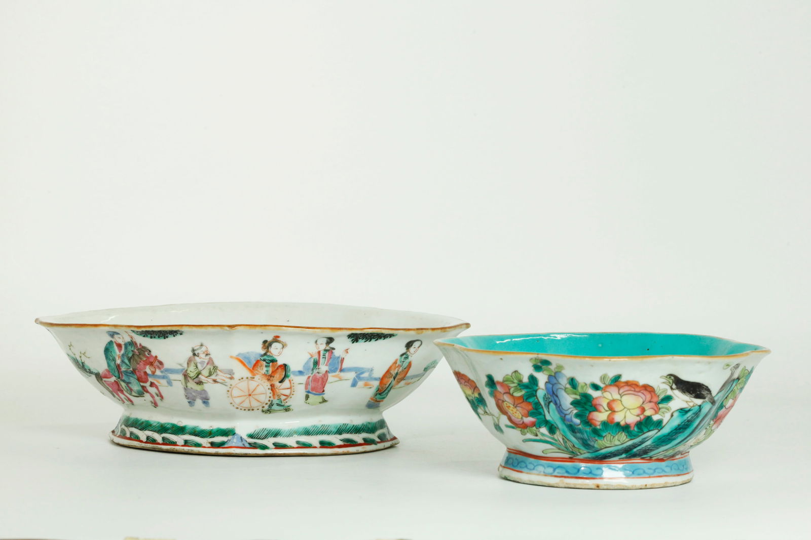 2 Chinese 19th C Enameled Porcelain Bowls: 2 Chinese 19th C Enameled Porcelain Bowls, the larger in ovoid quatrefoil shape well enameled with Figures in Gardens and 2 on Horses, the flared foot edge with waves, the inside and base in clear gla
