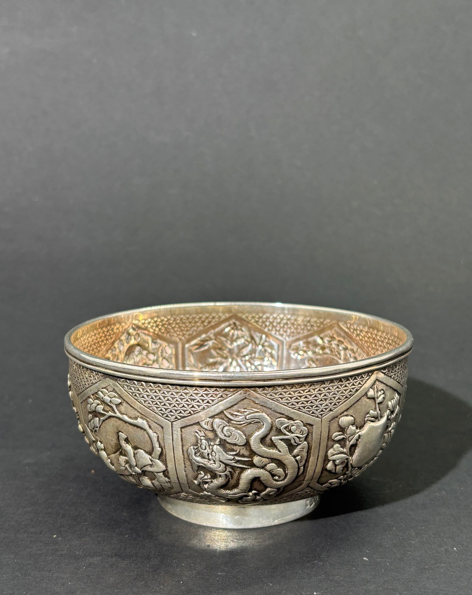 Wang Hing: Chinese Circa 1900 Repousse Silver Bowl: Wang Hing of Canton and Hong Kong circa 1900: fine Chinese Repousse Silver Bowl with an elegant design of 8 hexagons with different designs including a central hexagon with shield without engraving, a