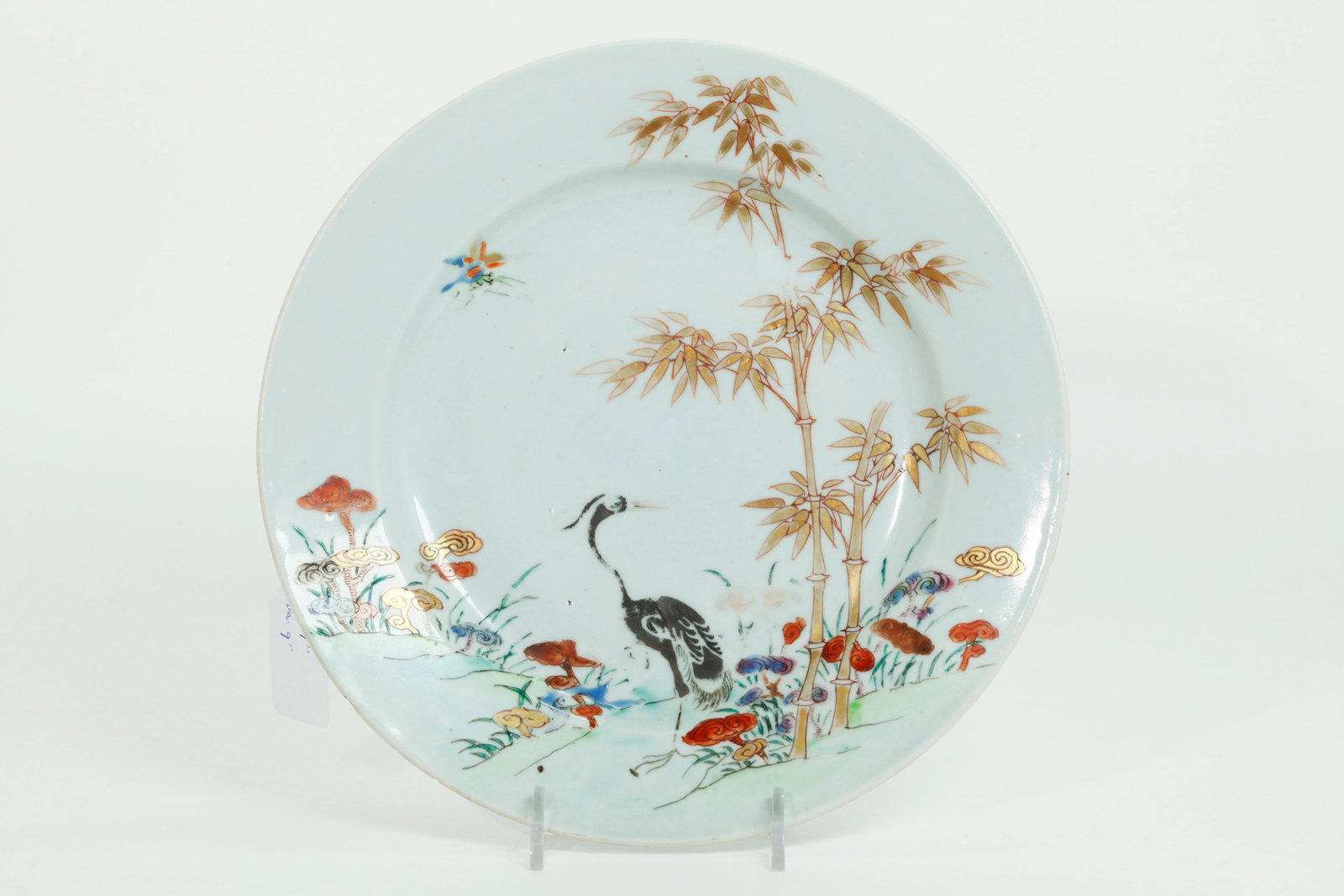 Chinese 18 C Egret Bamboo Lingzhi Porcelain Plate: Chinese 18th Century Export Plate with a design of an Egret in silver, Bamboo in gold and colored Lingzhi all on a clear glazed ground, the reverse in clear glaze. Diameter 9 inches X height 1 inch.