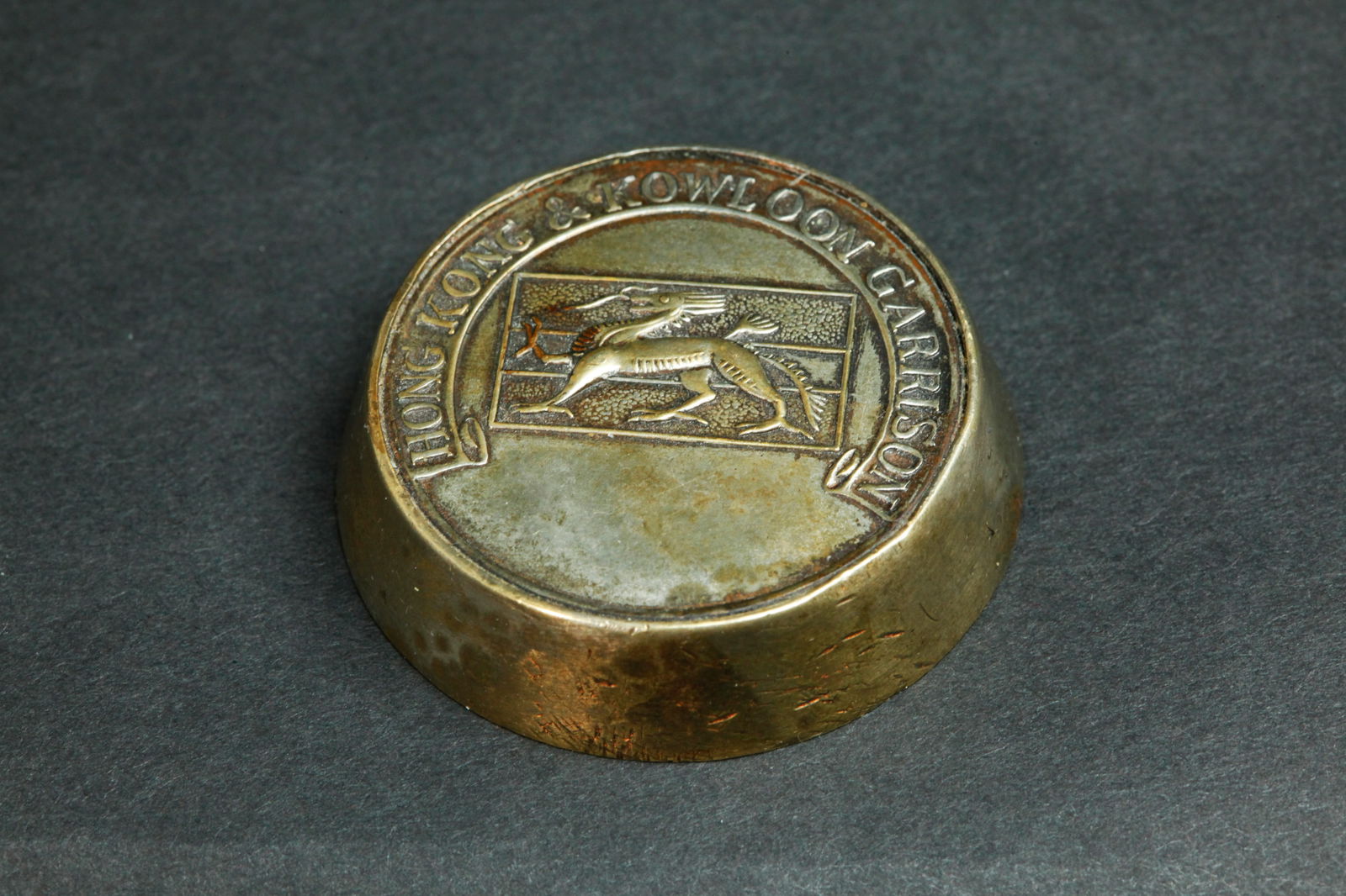 Chinese Hong Kong Kowloon Garrison Bronze Weight: Chinese Hong Kong Kowloon Garrison bronze round Weight with the Dragon Flag of the Hong Kong Military Service Corps during the British administration (1841-1997). Diameter 1 1/2 inches X height 3/8 in