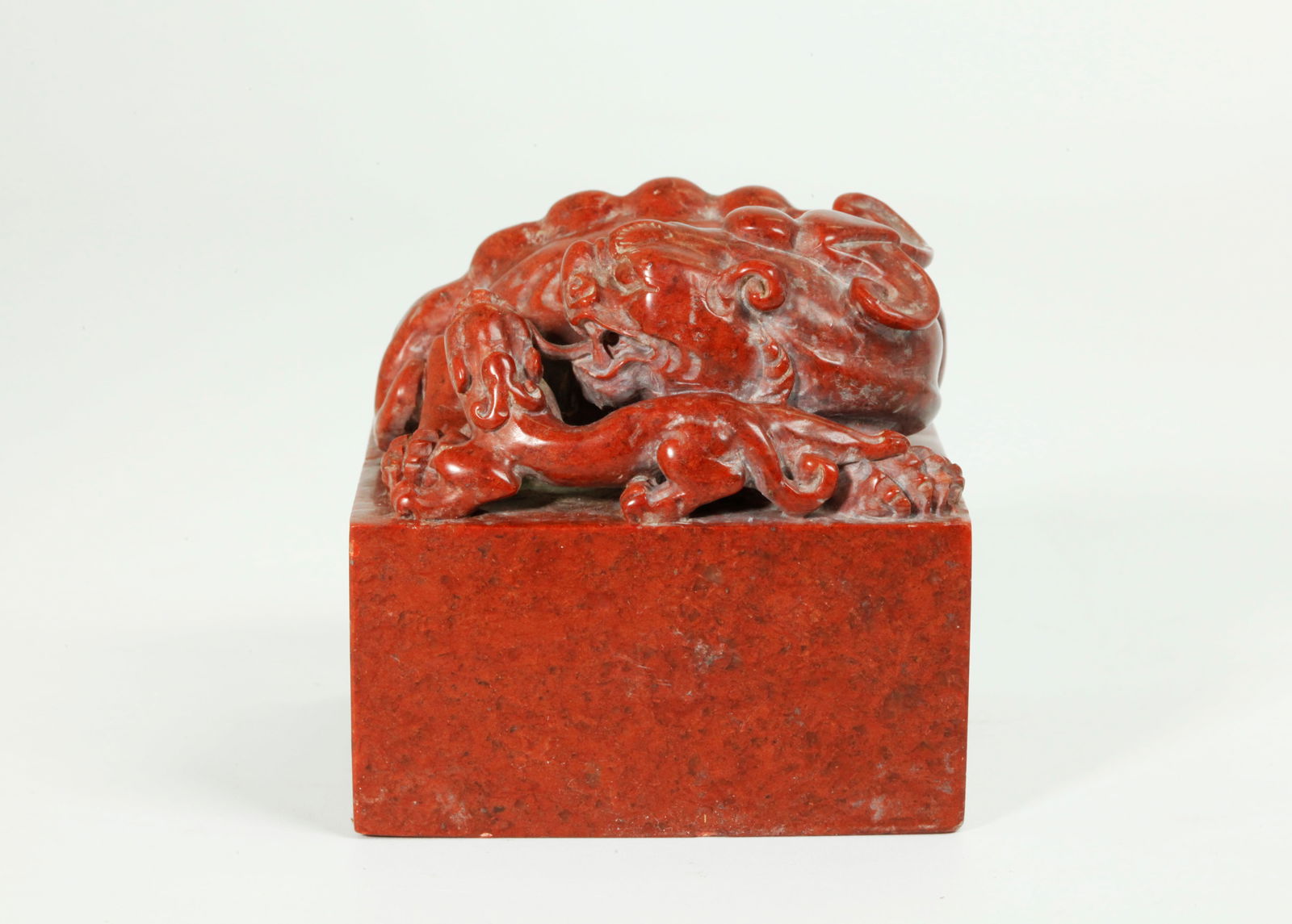 Lg Chinese Red Shoushan Soapstone Qilin Seal: Large Chinese variegated, dark red Shoushan Soapstone square Seal carved and polished with a large, double horn, double tail Qilin with its Baby, a calligraphy incised inscription to the side and the