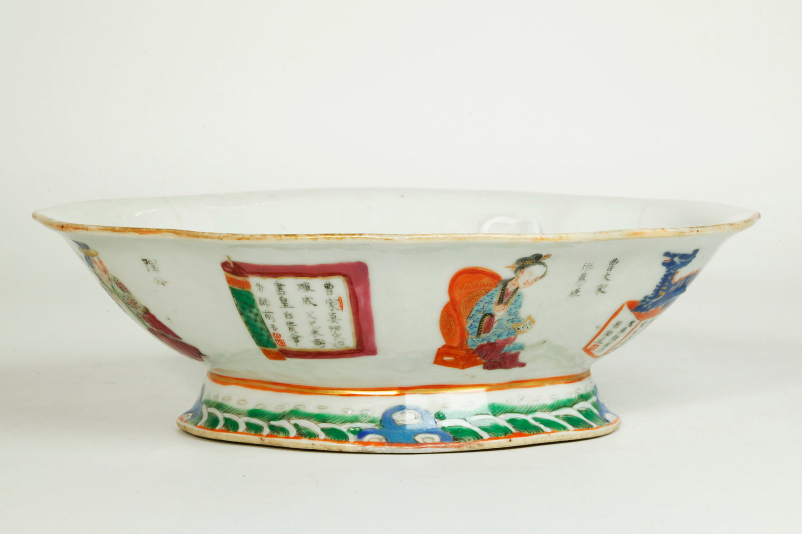 Chinese 19th C Wu Shuang Pu Porcelain Bowl: Chinese 19th Century "Wu Shuang Pu" Porcelain quatrefoil Bowl on high wave feetm the outside with designs of Heroes & Calligraphy inscriptions; the recessed base in clear glaze. Width 9 3/8 inches X h