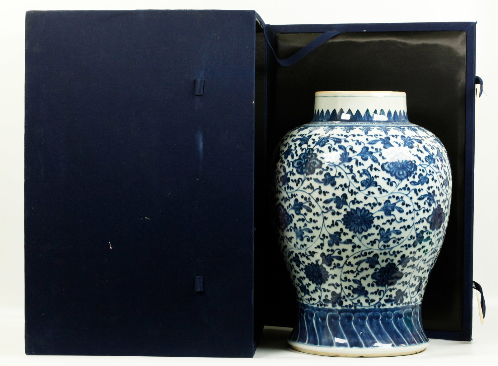 Large Chinese 18th C Blue & White Porcelain Jar: Fine Chinese 18th Century Blue & White Porcelain Temple Jar with a design of scrolling stems, leaves and flowers in 'Ming Style Heaped & Piled Effect" in underglaze blue between bands of waves at the