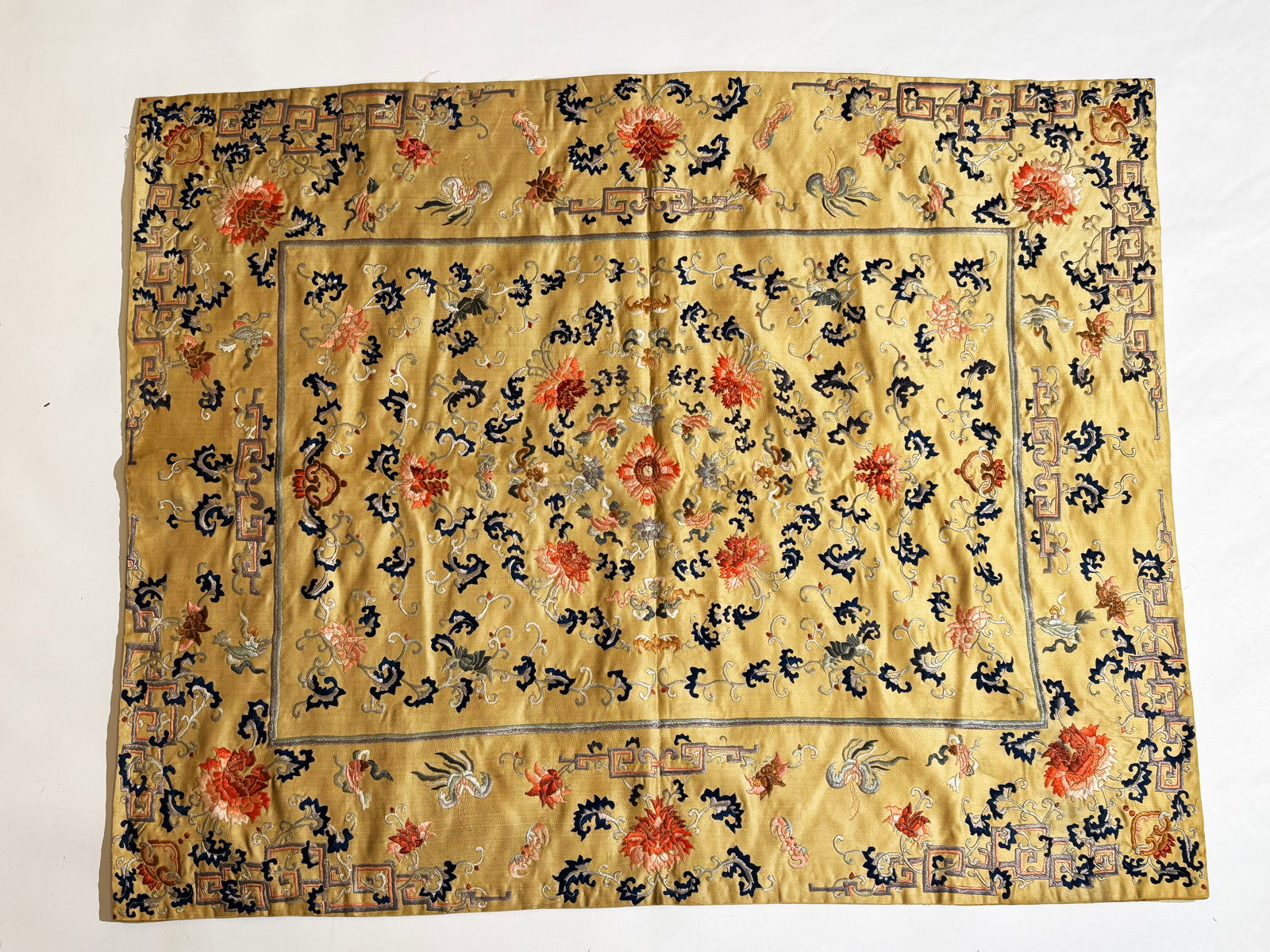 Chinese 19th C Pale Yellow Embroidered Table Mat: Fine Chinese 19th Century Pale Yellow Embroidered Table or Chair Mat with counted Satin Stitches of Lotus and Trellis in iron red to coral to pink and blue to lavender to pale grey; the rectangle line