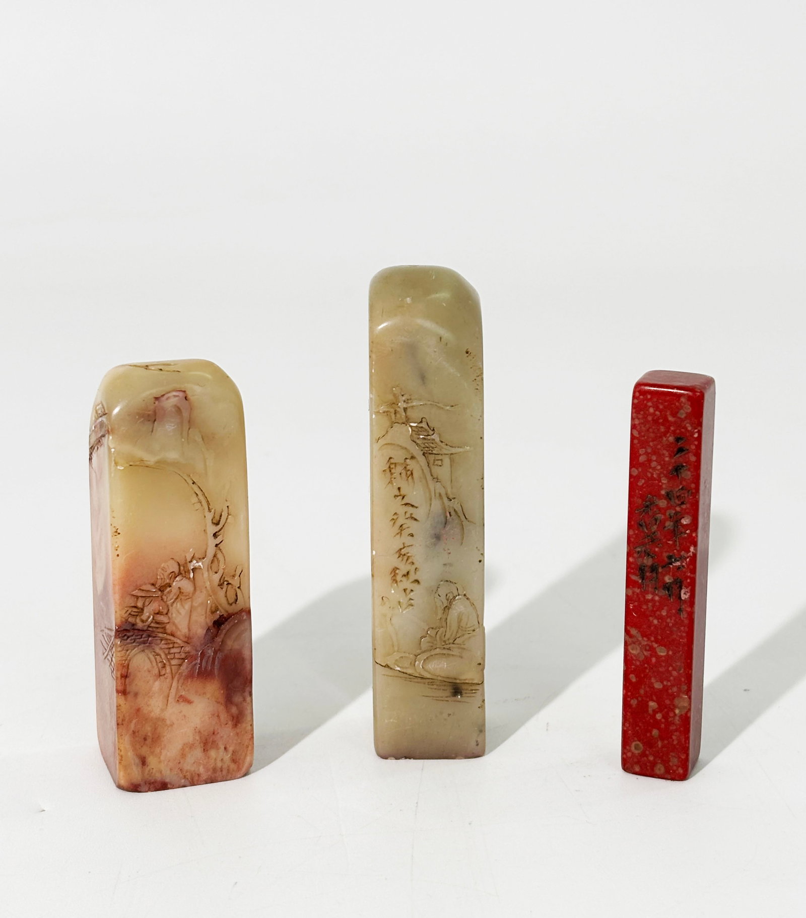 3 Old Chinese Soapstone Seals all carved: 3 Old Chinese Soapstone Seals all carved on the base, 2 with figures or landscapes on the sides. Height of largest 2 3/4 inches x width 3/4 inches.