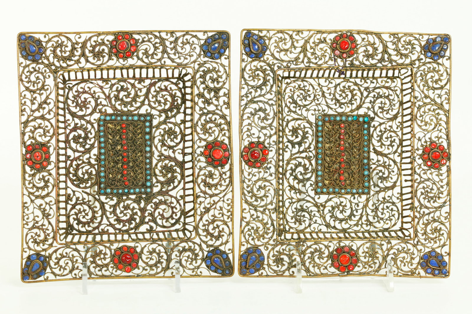 Pr Tibetan Nepalese Bronze Wire Work Wall Plaques: Pair Tibetan or Nepalese Bronze Wire Work rectangular Wall Plaques with ring hangers to short tops at back, the centers and edges inset with small stones possibly glass in blue, coral and turquoise. H