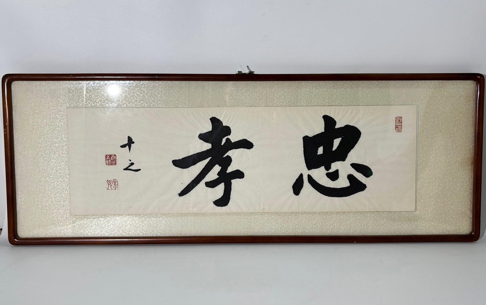 Zhang Longyan Chinese Ink Paper Calligraphy Panel: Zhang Longyan ( 1909-2009); Chinese Horizontal Ink & Paper Calligraphy Panel with 3 red seals, the paper mounted on fabric covered borders and framed to edges of borders with rounded edge wood. Height