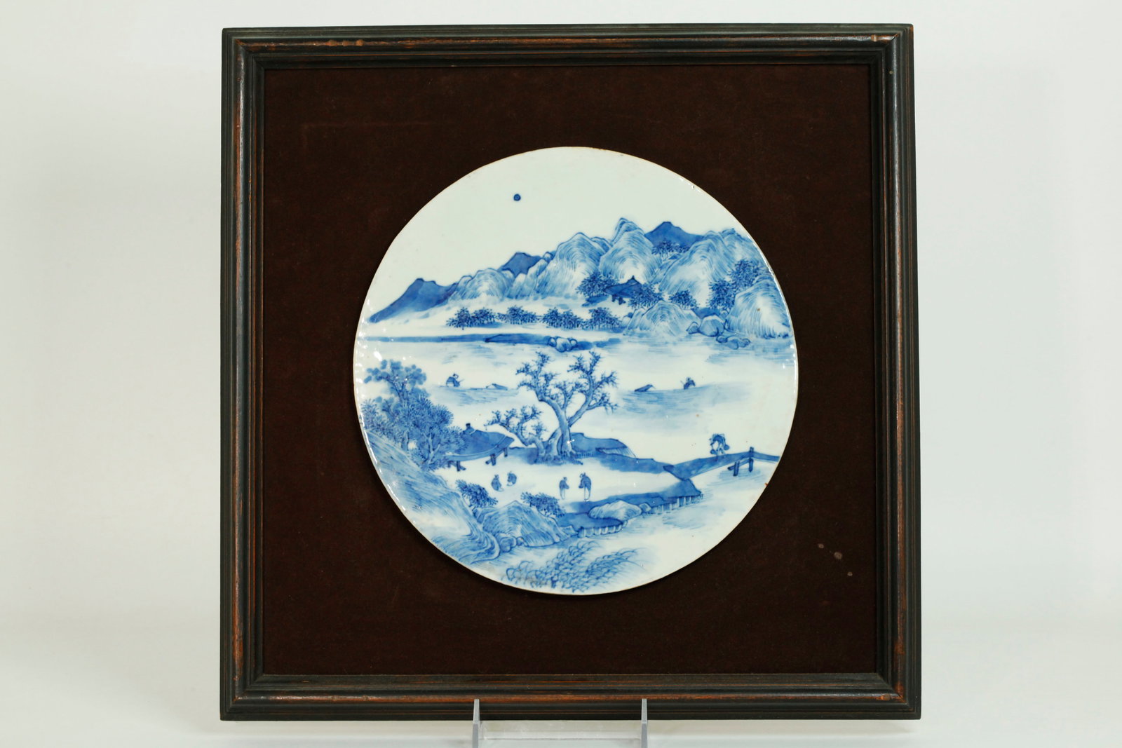 Chinese 19th C Blue & White Porcelain Round Plaque: Chinese 19th Century Blue & White Porcelain Round Plaque well painted with a mountain lake Landscape with figures and viewing pavilions; now mounted to a velvet covered backboard and framed square. Di