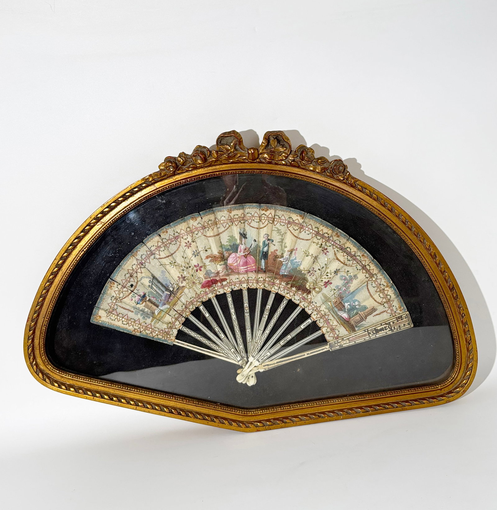 European 18th C Neo-Classical Painted Fan & Frame: European 18th Century Neo-Classical Painted Fan with 3 figures to center with urns, columns, doves, to sides and borders and flower sprigs with polished metal paillettes and embroidery, the sticks in