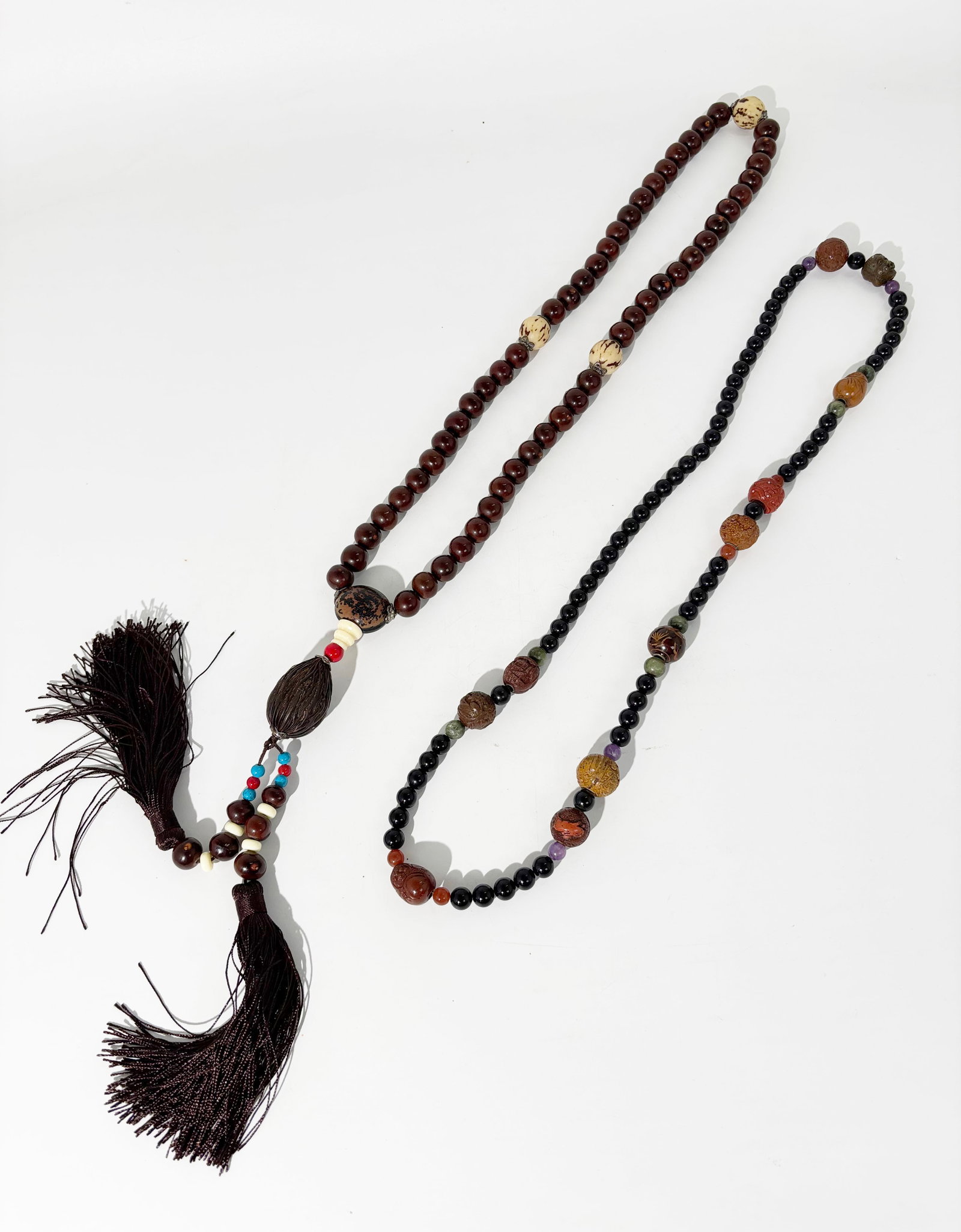 Chinese 54 Nut Bead Rosary 11 Ojime Bead Necklace: Chinese 54 Nut Bead Rosary with lacquered and polished nuts or seeds ending in 2 silk tassels; together with a necklace of black beads strung with 10 pressed composition Ojime Beads, possibly lacquere