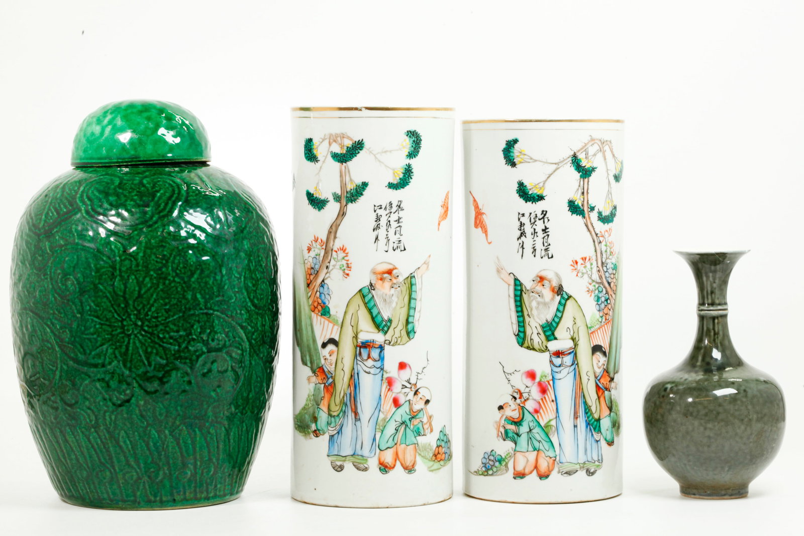 Pr Chinese Porcelain Hat Stands; 2 Monochromes: Mirror Pair Chinese Porcelain Hat Stands enameled with opposing designs of an Aged Scholar with 2 young Boys & a Bat in a Garden with calligraphy, 1 with old Chen Shin Company paper label to bottom; t