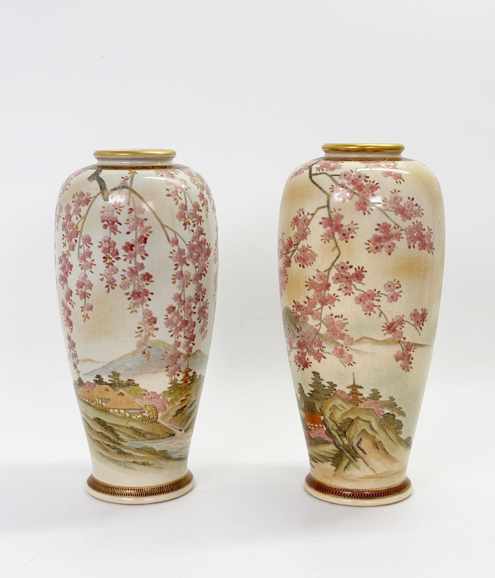 Pair Japanese Satsuma Porcelain Vases: Pair Japanese Satsuma Crackle Porcelain Vases with scenes of a group of Buildings, probably a Temple with a Pagoda, seen through hanging tree blossoms, with gold details and slight gold spray; mark to