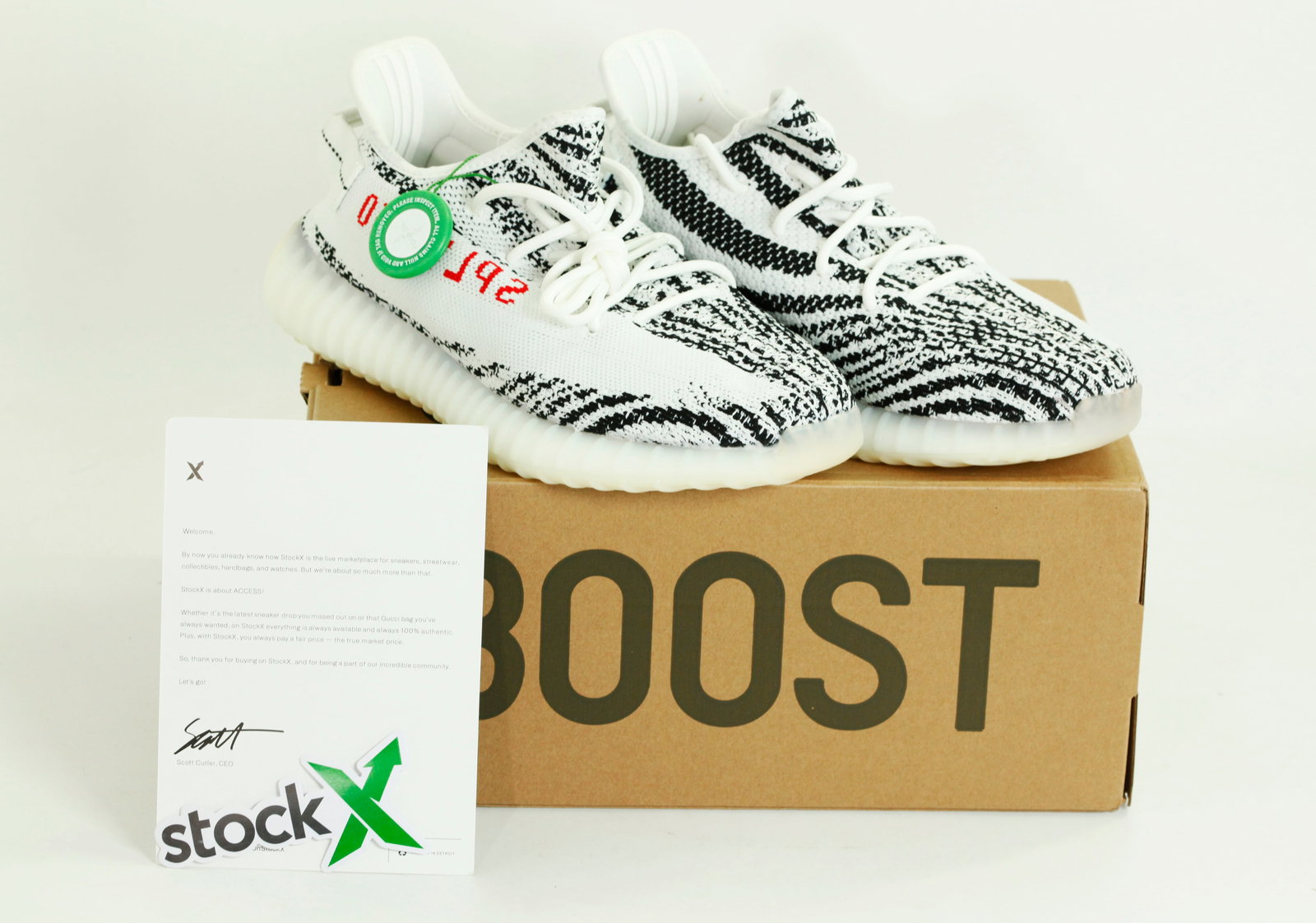 Adidas: Pr Yeezy Boost 350 V2 Sneakers Size 10US: Adidas: Pr Yeezy Boost 350 V2 Sneakers Size 10US; original printed box with design/size label, the right shoe with 2 hang tags with bar coding and with green plastic "StockX" Verified Authentic round