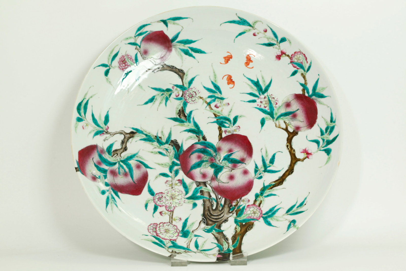 Lg Chinese Enamel 9 Peach Porcelain Display Plate: Large Chinese Famille Rose Enameled Porcelain Display Plate with a design of 9 Peaches with blossoms, leaves and branches starting at the unglazed foot ring with 2 peaches and continuing over the outs