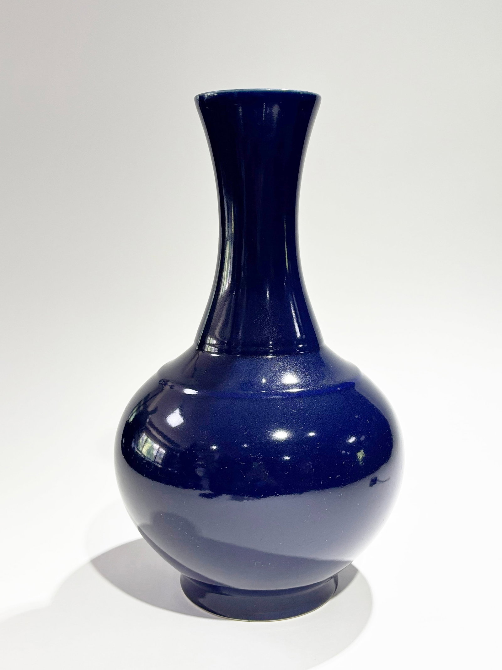 Chinese Blue Monochrome Glaze Porcelain Vase: Chinese Cobalt Blue Monochrome Glazed Porcelain Vase with cobalt blue to recessed base and a 6 character Guangxu mark in darker blue under the glaze at the center of base. Height 15 3/8 inches X width