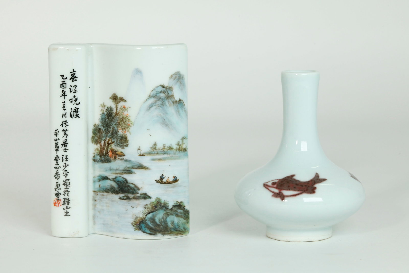 2 Chinese Scholars Desk Porcelains Vase Ink Rest: 2 Chinese Scholar's Desk Porcelains; a small Vase in clear glaze with 3 underglaze red Fish and recessed base in clear glaze; together with an Artist enameled Ink Stick Rest or brush rest shaped as an