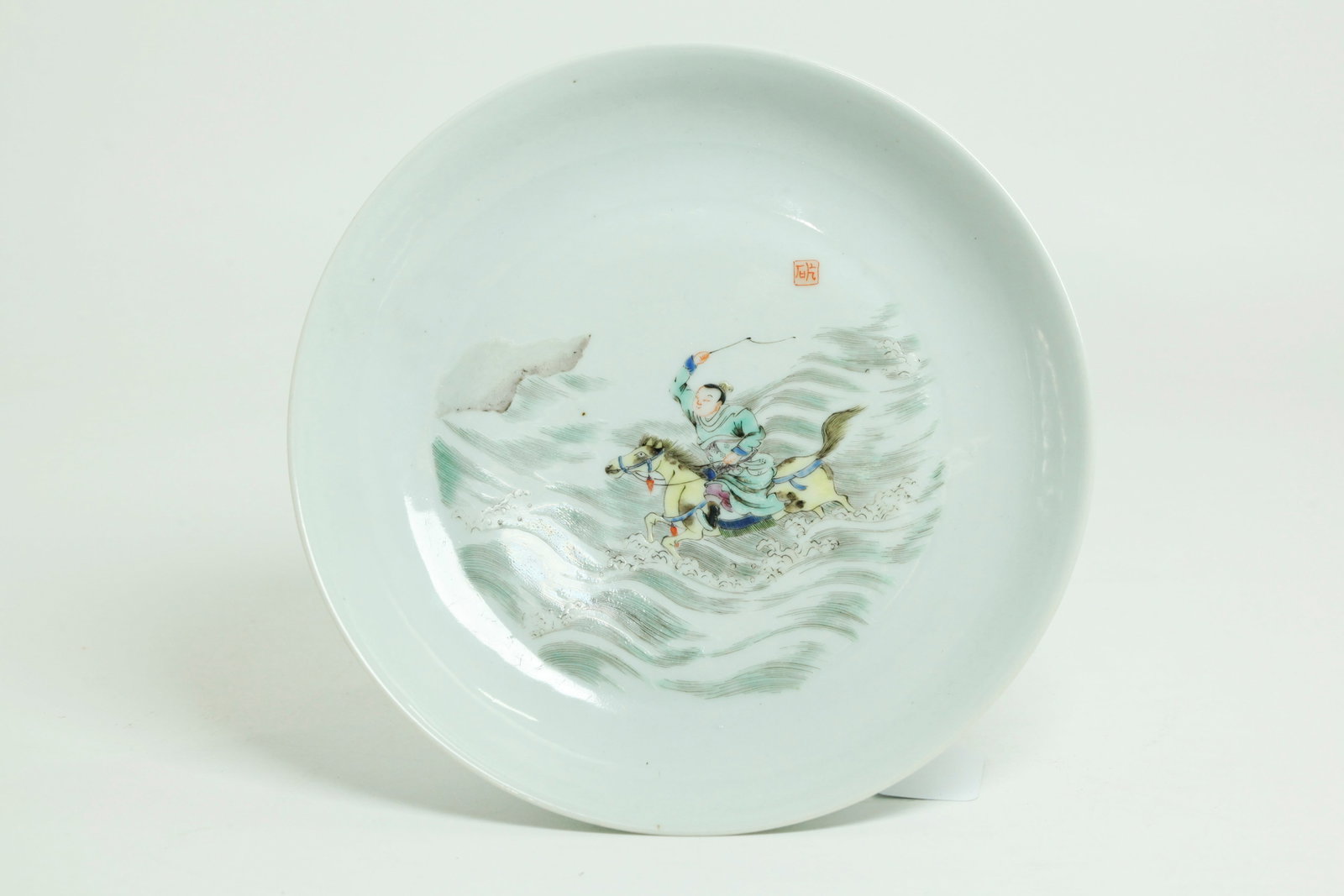 Fine Chinese 18th C Enameled Porcelain Plate: Fine Chinese Porcelain Plate probably Kangxi Period and enameled with a Young Scholar with a touch of Western pink to pants, riding a yellow Longma Horse over waves or flooding, small seal in sky in i