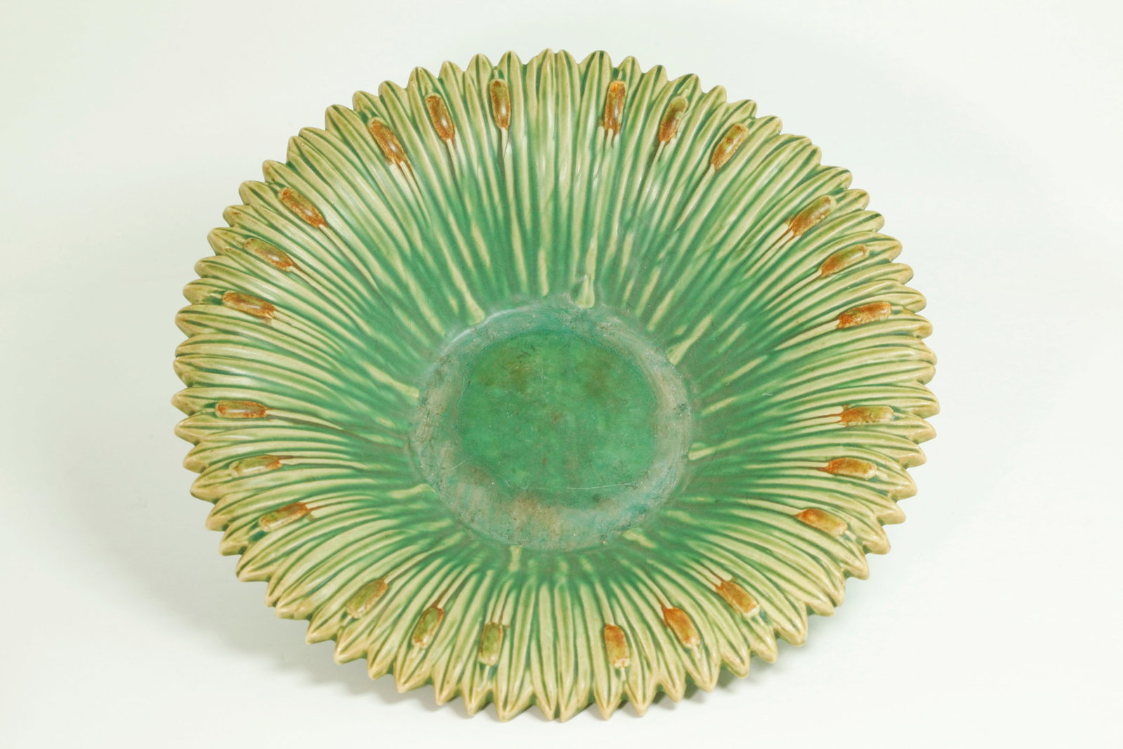 Lg Weller Pottery Matte 1920's Cattail Center Bowl: Large Weller Pottery Co; "Ardsley" matte glazed ceramic centerpiece bowl in light green draining to pale green adorned with cattails in brown along the flared rim, Zanesville, Ohio, circa 1920, ink-st