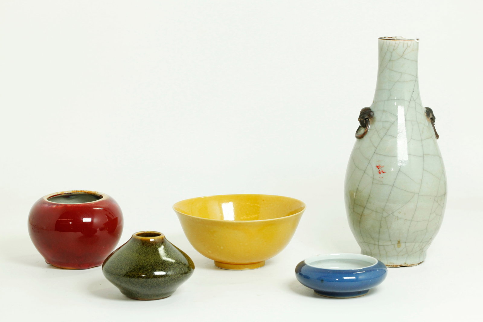 5 Chinese Qing Monochrome Porcelains: 5 Chinese Qing Dynasty and later Monochrome Porcelains: an "Imperial yellow" enameled bowl with recessed base in clear glaze with 6 character Hongzhi mark inside double rings all in underglaze blue, a