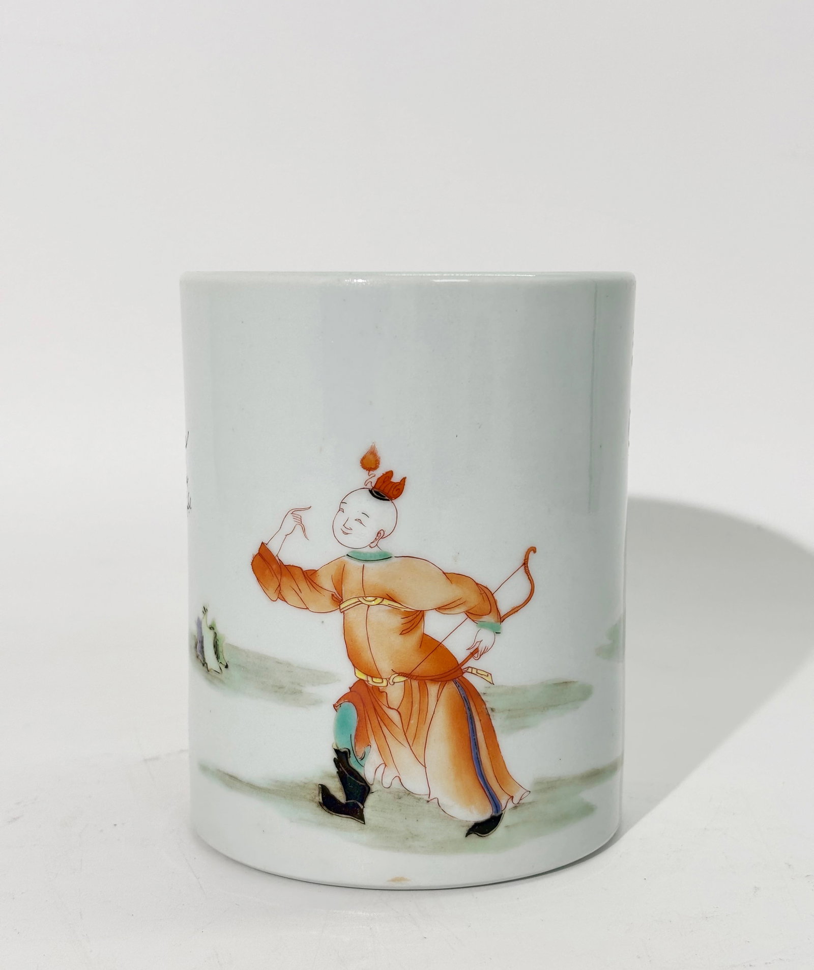 Chinese Famille Rose Porcelain "Boys" Brush Pot: Chinese Famille Rose Porcelain Brush Pot with a design of a Successful Boy Archer and 2 Brothers in Garden to sides, the concave base with a glazed edge. Height 4 3/4 inches x Diameter 4 inches.