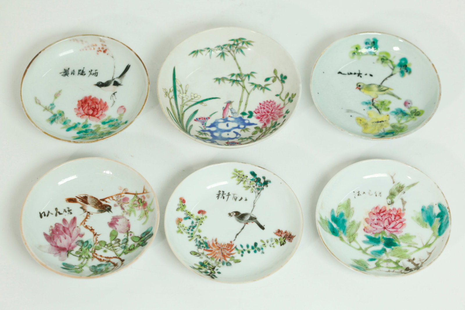6 Chinese Qing Enamel Sm Plates: Guangxu & Artist: 6 Chinese Qing Dynasty Enamel Small Plates: the largest finely enameled with exotic Bird on Garden Rock with Rose, Bamboo, Lingzhi and Paper White with 6 character Guangxu mark in underglaze blue and 