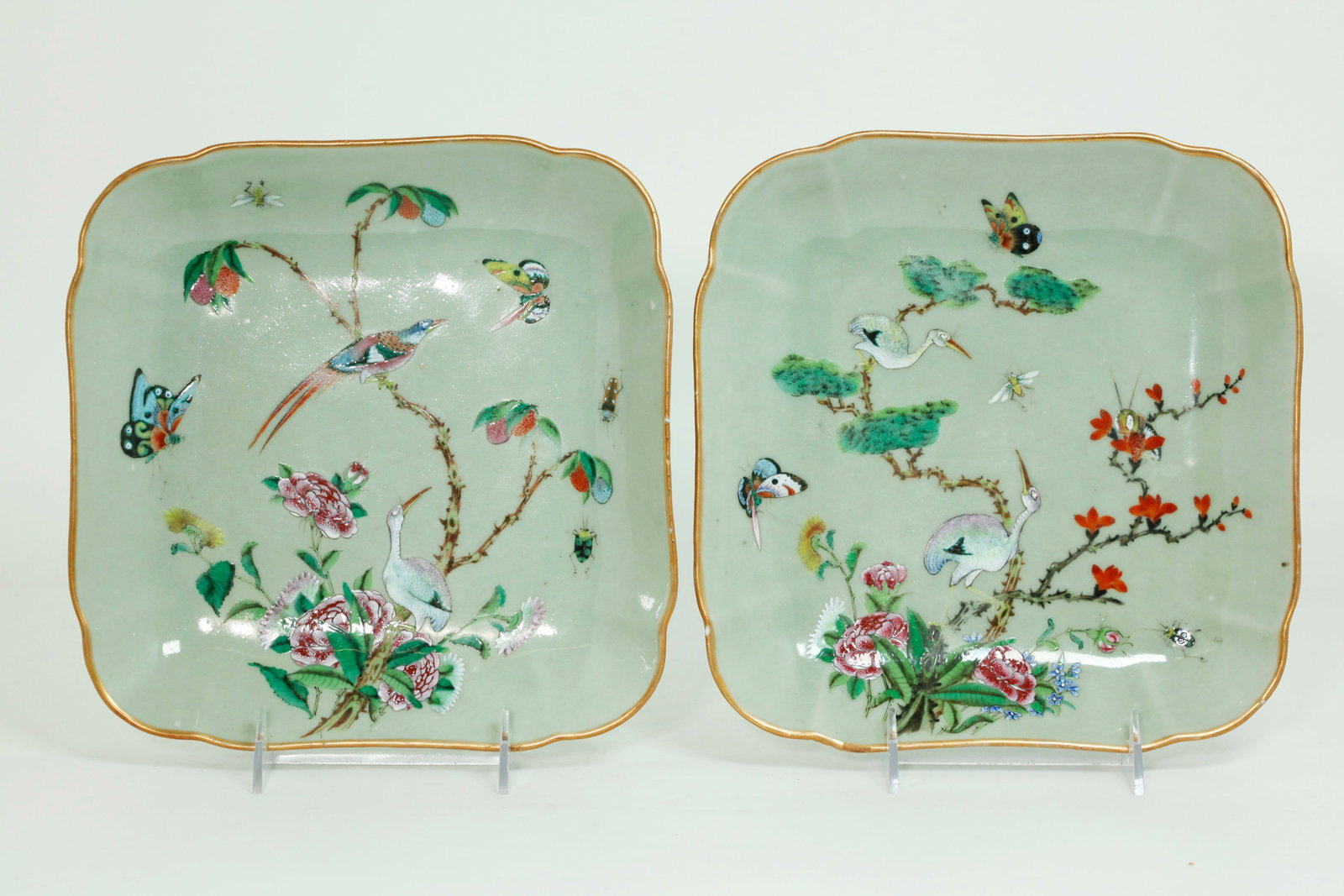 Pr Chinese 19th C Celadon Porcelain Square Plates: Complimentary Pair Chinese 19th Century Enameled Celadon Glazed Porcelain Square Plates with double canted corners and a design in Famille Rose of exotic Birds, 1 in a Pine Tree and 1 in Lychee tree (
