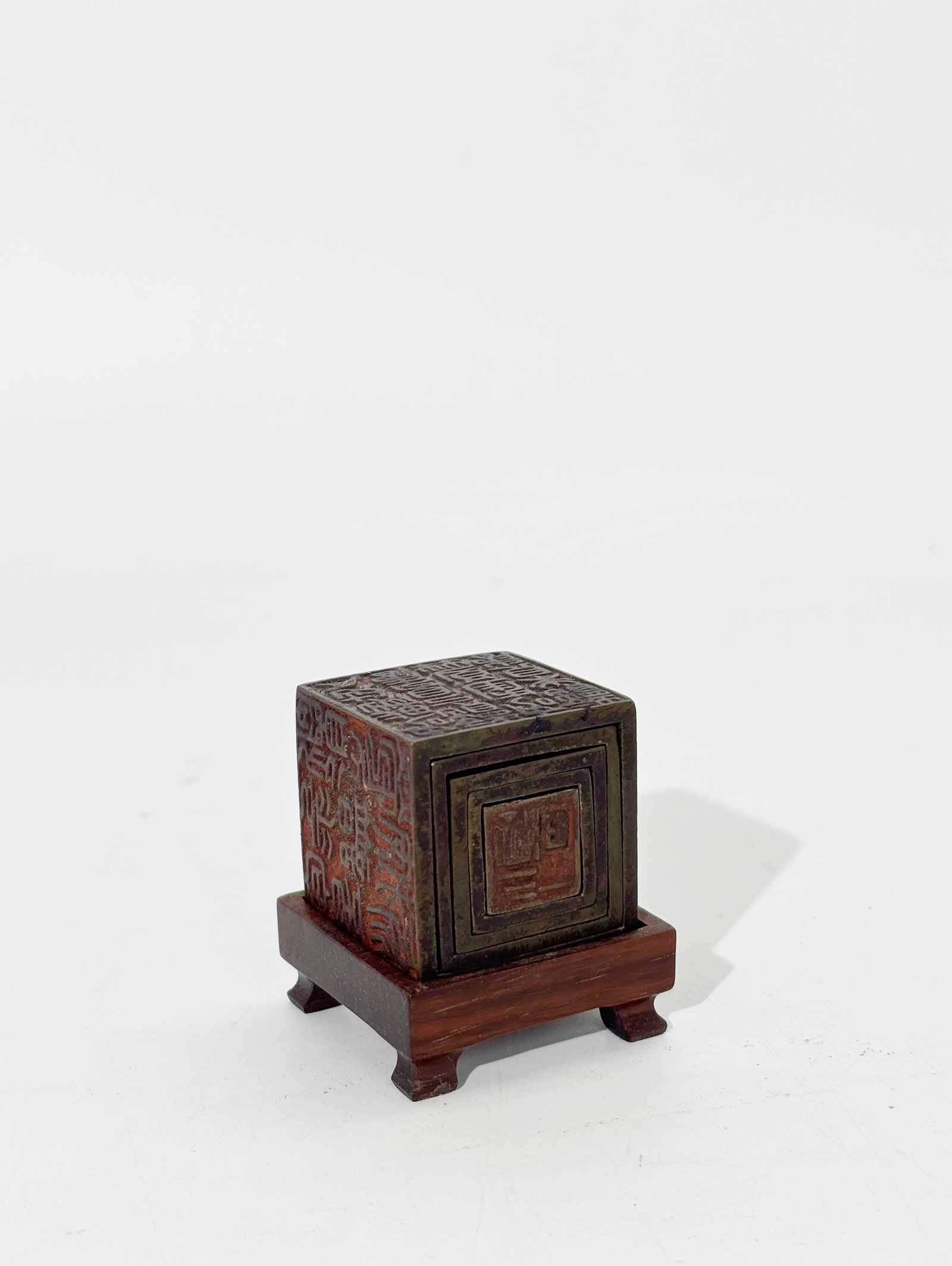 Rare Chinese 19 C 5 Nesting Bronze Cubes 26 Seals: Rare Chinese 19th Century Bronze Casting of 5 nesting Cubes, 4 with 5 seal faces each and the smallest with 6 seal faces for a total of 26 Seal faces; square hard wood stand on 4 small feet. Height wi