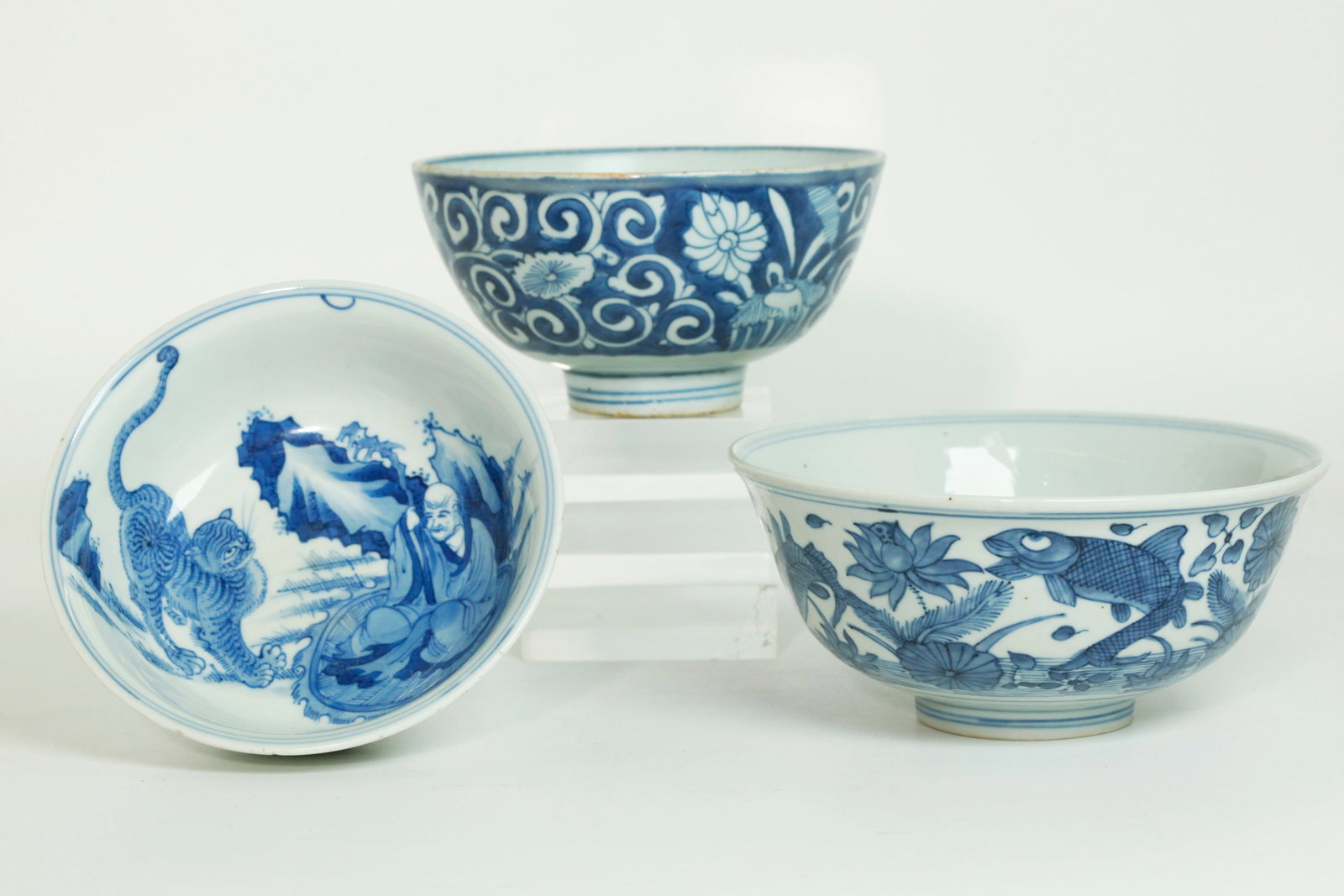 3 Chinese Blue White Porcelain Bowls: 3 Chinese Blue & White Porcelain Bowls; 2 Ming Dynasty with the larger with a design of Fish in a Lotus Pond and the base with 6 character Wanli mark inside double rings all in underglaze blue, the sm