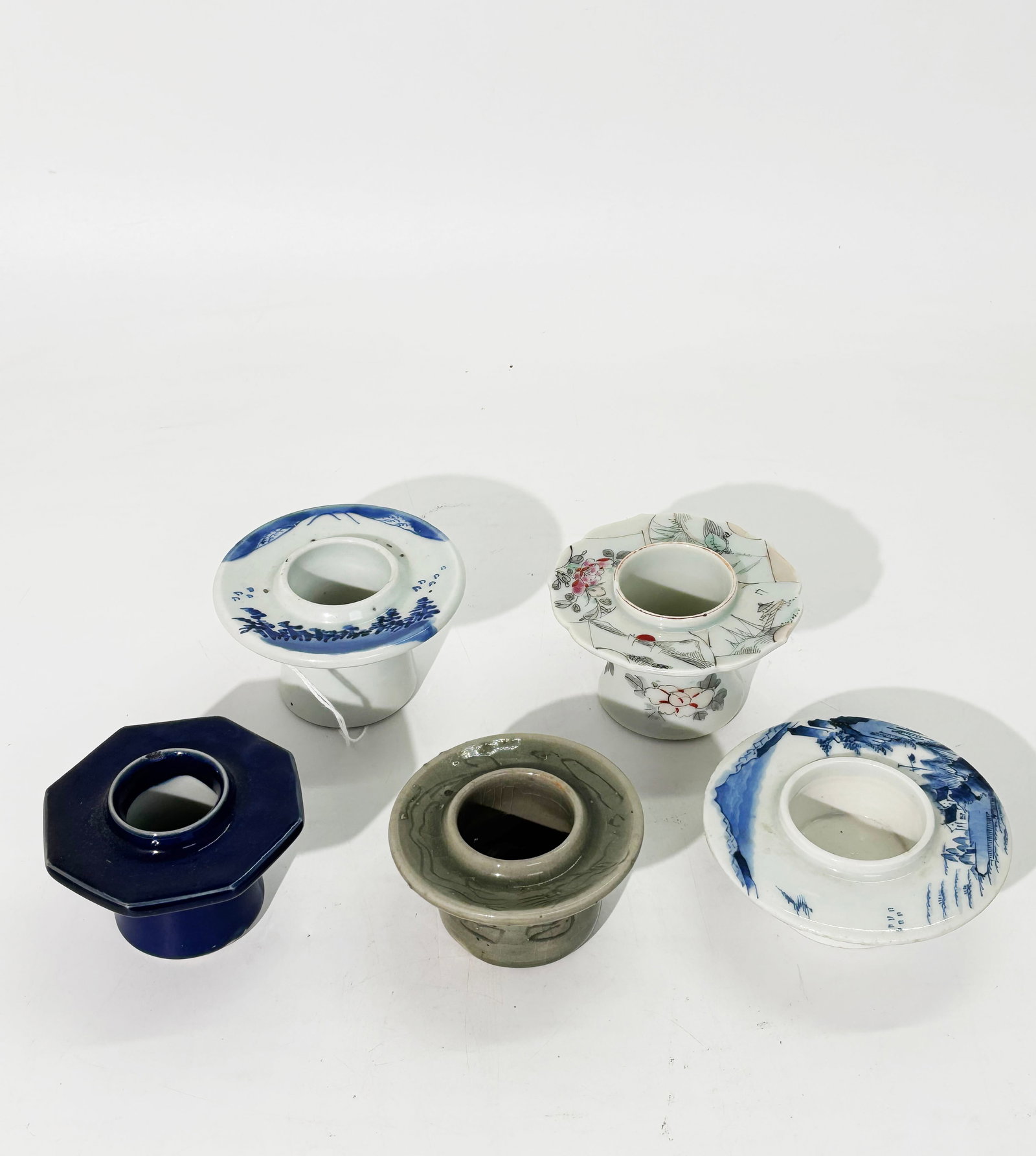 5 Japanese Meiji Porcelain Sake Cup Stands: 5 Japanese Meiji Period Porcelain Sake Cup Stands (ideal holders for thick candles): 2 with underglaze blue Mount Fuji landscapes, 1 with enameled fan paintings, 1 in cobalt blue and 1 in celadon with