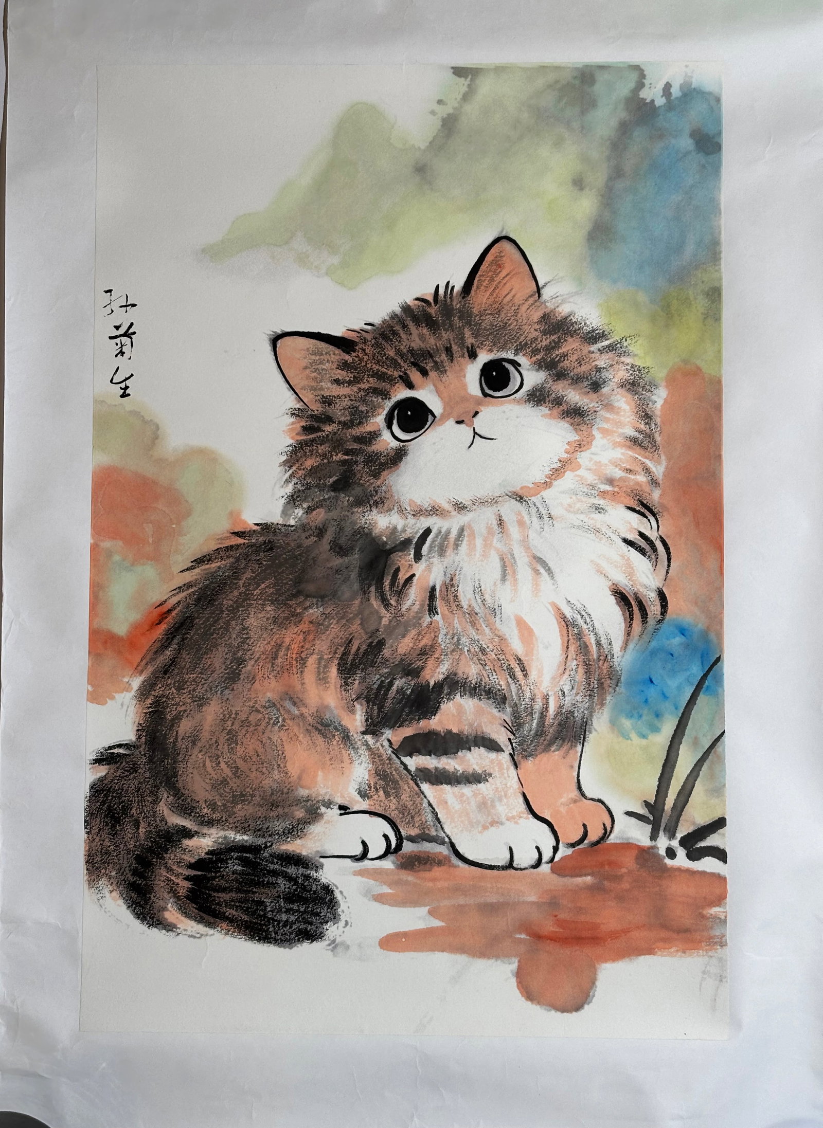 Attributed to Sun Jusheng; Kitten Painting on Pap: Attributed to Sun Jusheng (1913 – 2018); Ink & color painting of a Kitten on paper mounted to paper with borders; with calligraphy. Height of art 27 3/4 inches X width 18 inches. PROVENANCE: From a 