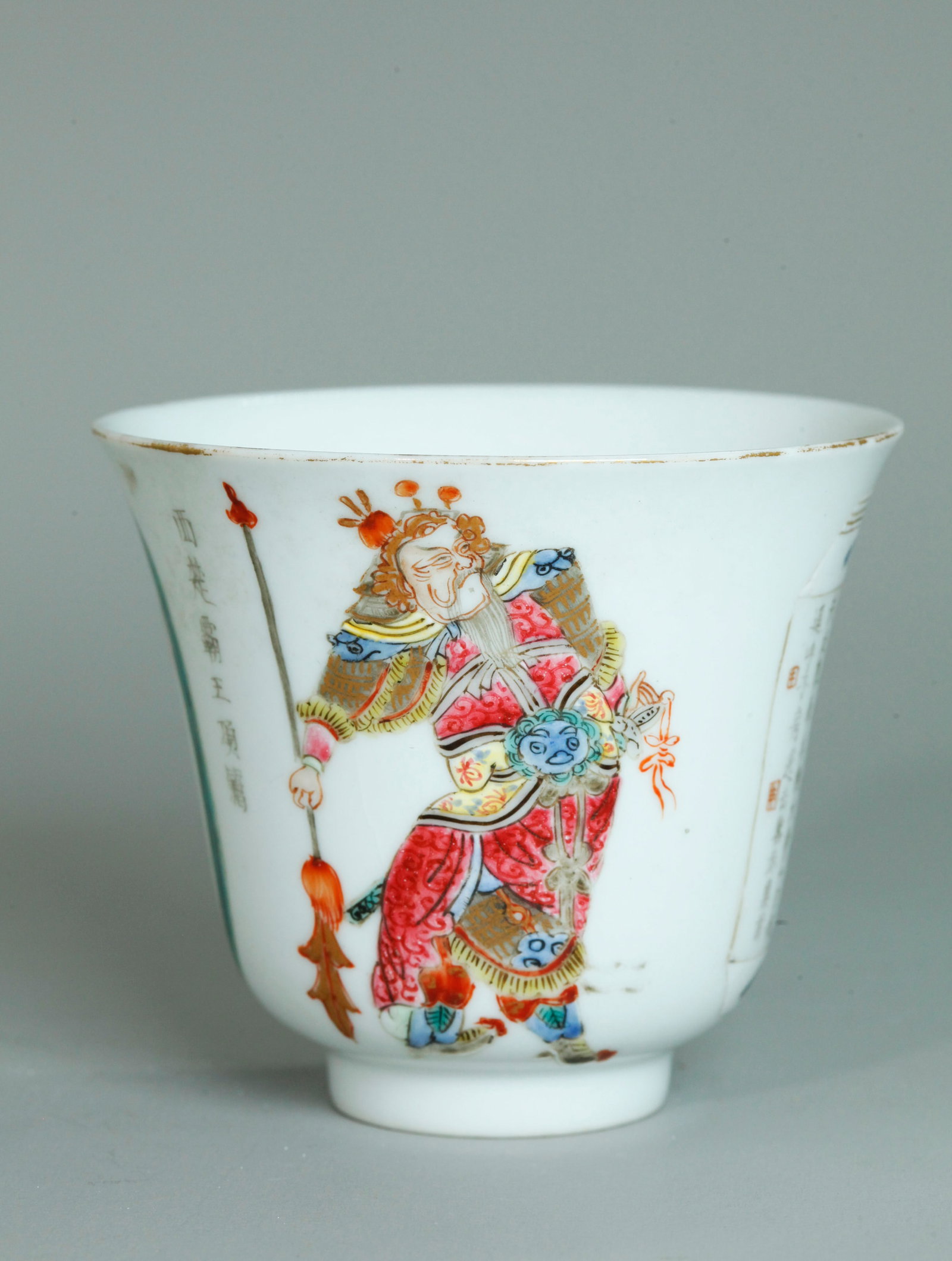 Chinese Wu Shuang Pu Enameled Porcelain Teacup: Chinese Qing Dynasty Wu Shuang Pu Enameled Porcelain Teacup with the standing figures of 2 Historical Heros separated by calligraphy inscriptions; the base in clear glaze. Height 3 inches X diameter 3
