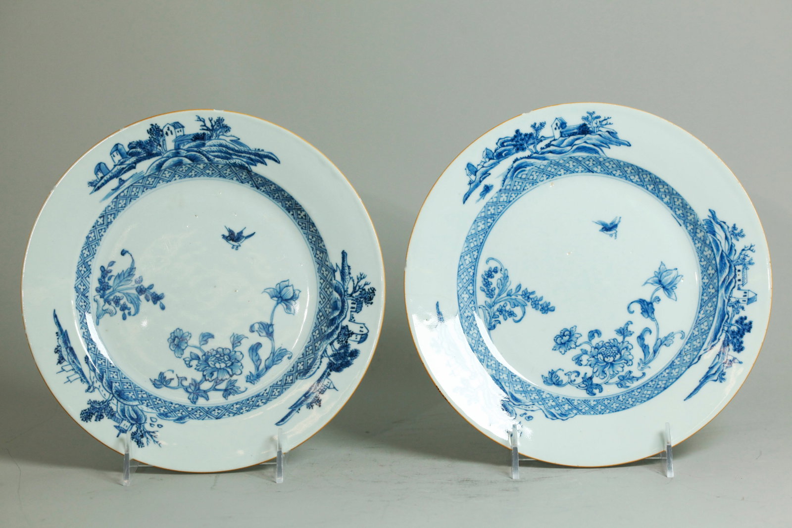 Pr Chinese 18C Blue White Export Porcelain Plates: Pair Chinese 18th Century Blue & White Export Porcelain Plates with flowers and a bird to centers, a brocade band to sides and 3 small European Landscapes to edge; the bottoms in clear glaze. Diameter