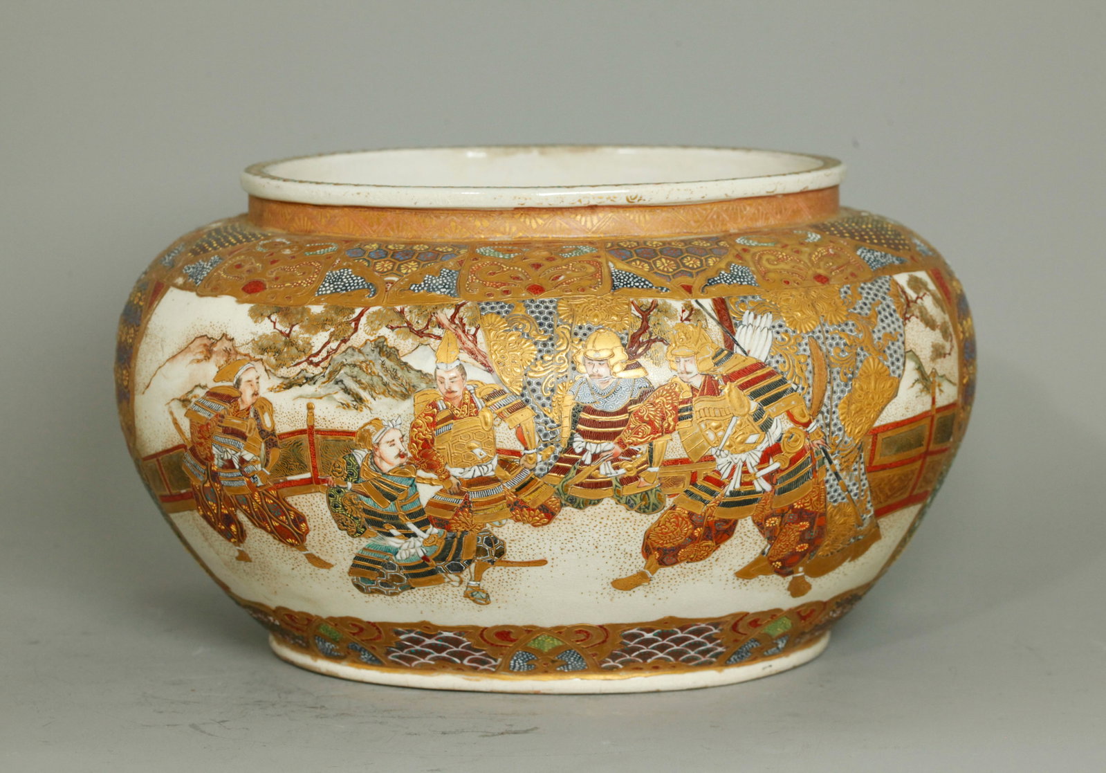 Japanese Satsuma Samurai & Court Porcelain Urn: Japanese oval Satsuma crackle Porcelain Urn decorated to the outside in colors with flat and raised gilding with a Samurai scene to one side and a Court scene to the reverse, the slightly recessed bas