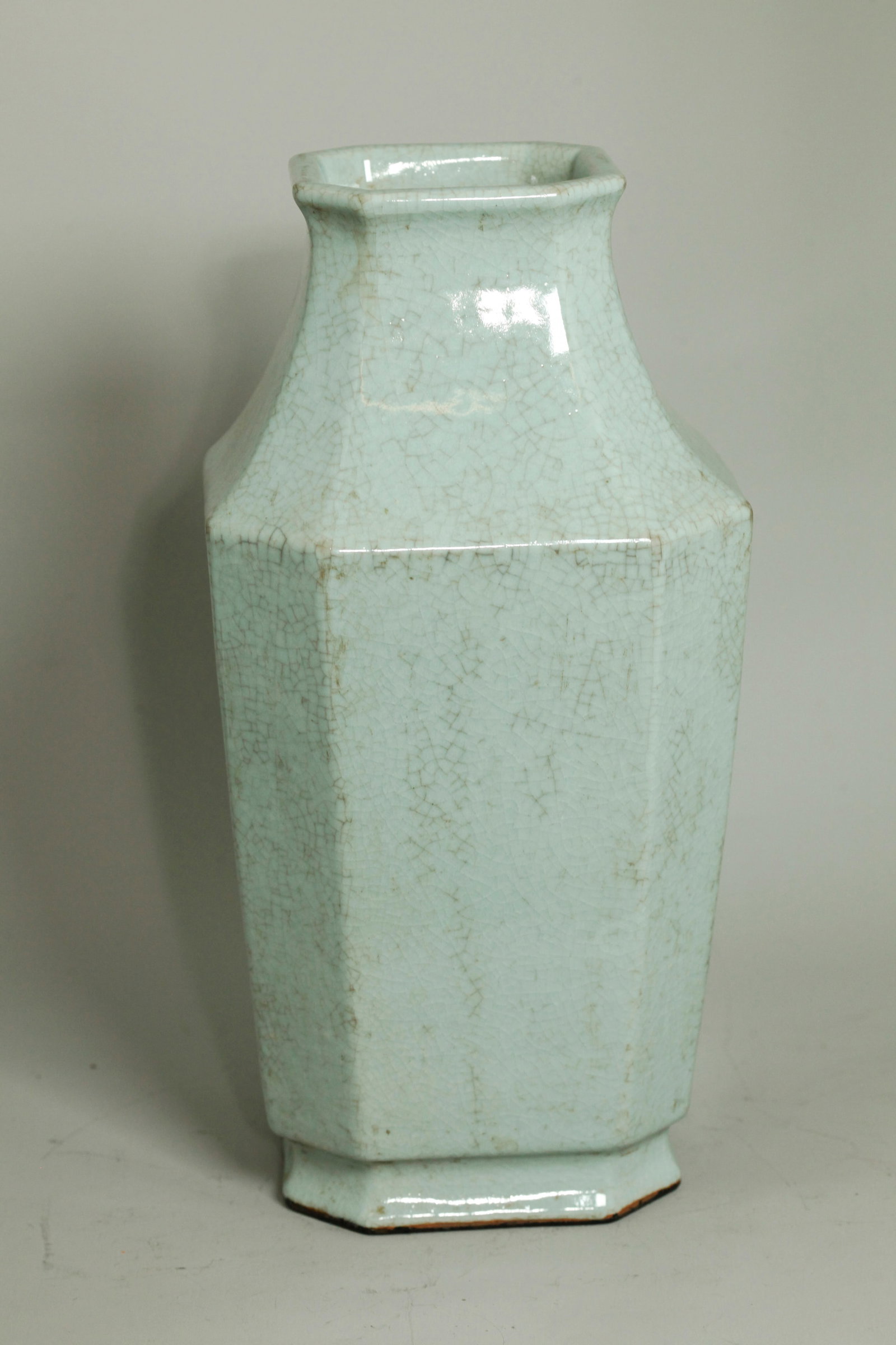 Chinese Octagonal Guanyao Crackle Porcelain Vase: Chinese Octagonal Guanyao Crackle Porcelain Vase, the flared foot with recessed base in crackle with 6 character Qianlong seal mark in underglaze blue; the unglazed foot appears lacquered black. Heigh