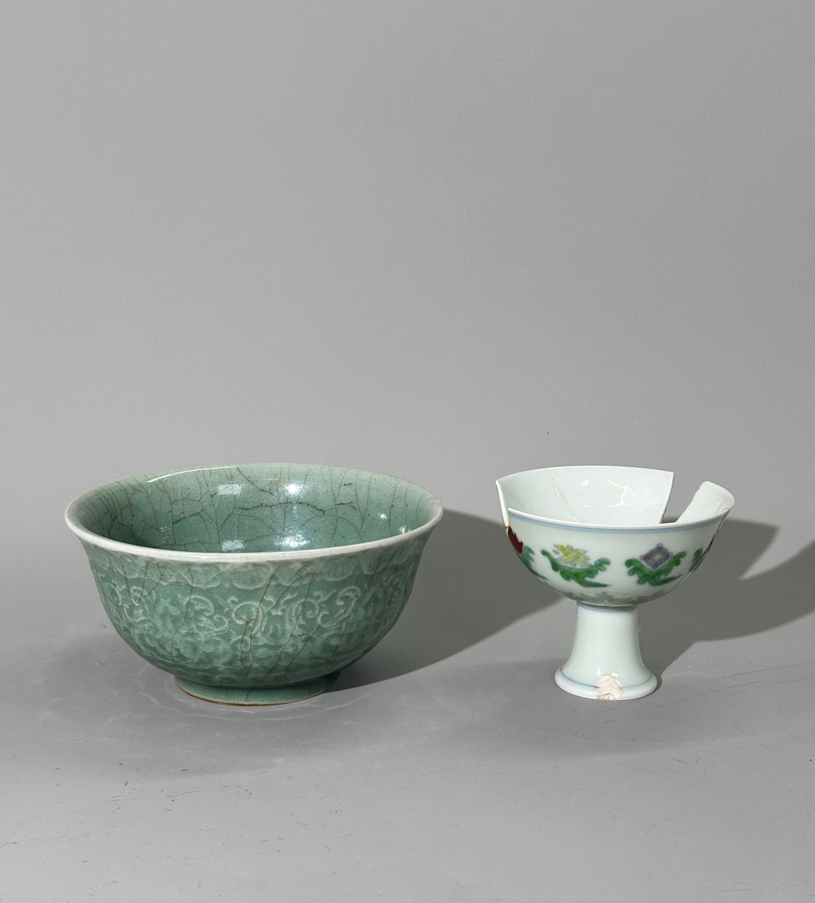 Bonham's; Chinese Porcelain Bowl; Doucai Stem Cup: Bonham's; Chinese Qing Dynasty porcelain crackle Celadon glazed Bowl, the bubble suffused glaze carved & molded to outside with floral bands with the unglazed foot ring burned in the kiln firing; toge