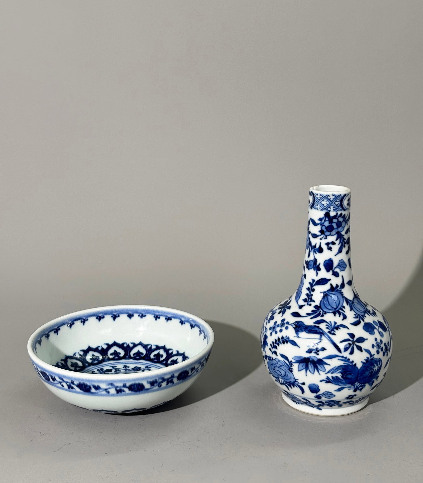 2 Chinese Blue & White Porcelains: Bowl & Vase: 2 Chinese Blue & White Porcelains: a "loaf-center" Bowl with clear bubble suffused glaze, a concave bottom and domed surface with floral bands in rich underglaze blue; together with a Vase with Birds,