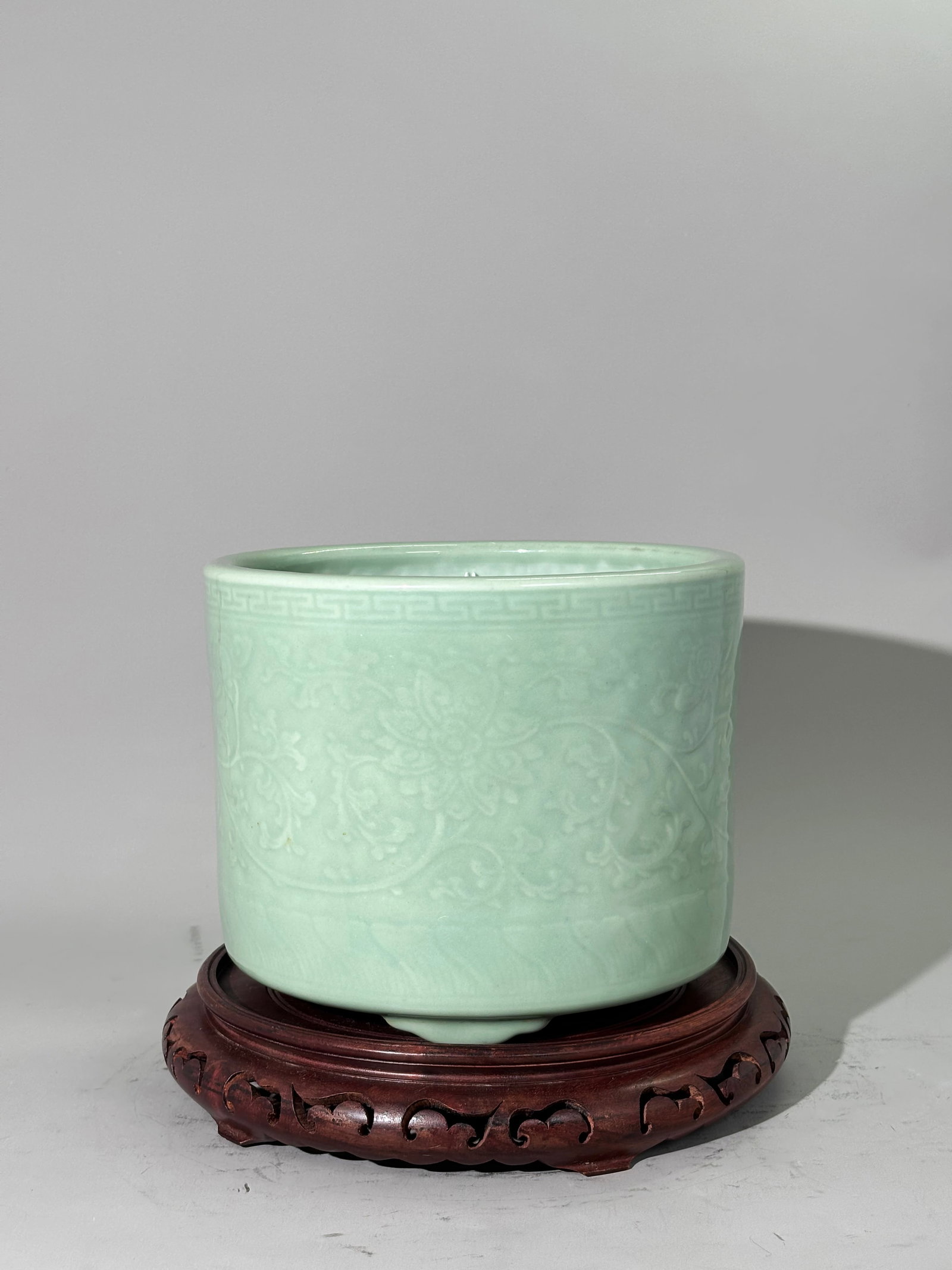 Lg Chinese Celadon Porcelain Carved Censer: Large Chinese Celadon Porcelain Censer with carving to the sides of scrolling flowers between key fret band under mouth and lappet petal border to base, the glaze over the 3 feet and to outside edge o