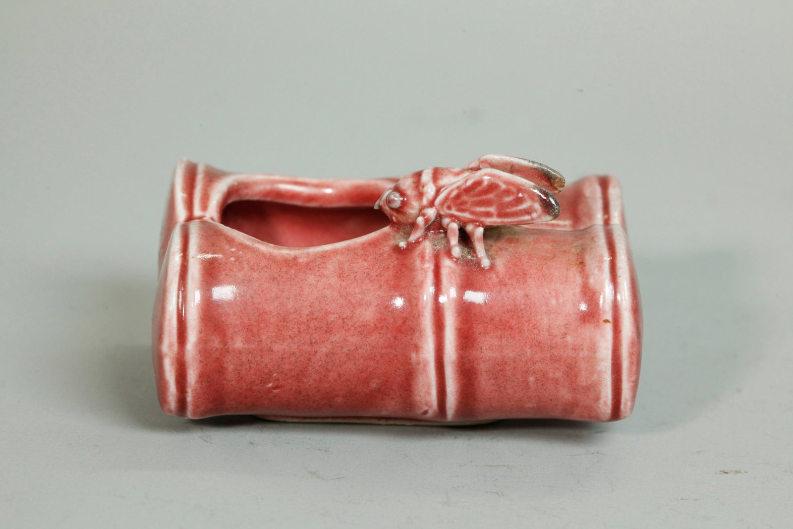Chinese Qing Underglaze Red Porcelain Brush Washer: Chinese Late Qing Dynasty Underglaze Red Porcelain Brush Washer shaped as 2 lengths of bamboo with a small insect with oval unglazed foot. Height 2 inches X width 3 1/8 inches.