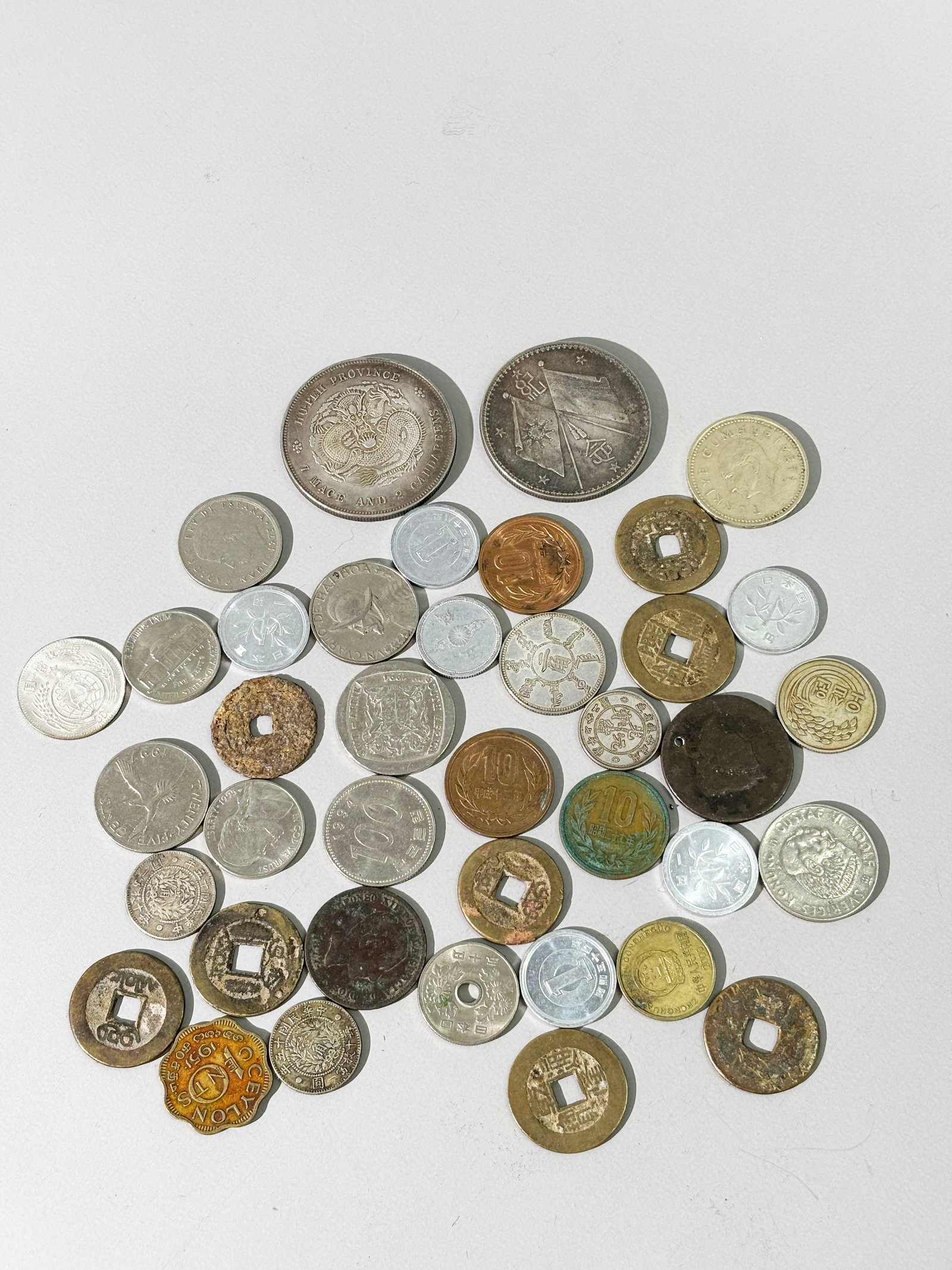39 Various World Coins; See Images: 39 Various World Coins; See Images. Diameter of large coin 1 1/2 inches.