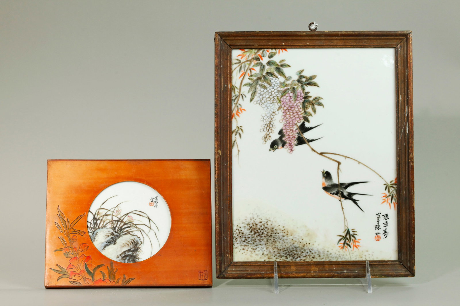 2 Small Chinese Enameled Porcelain Plaques: 2 Small Chinese Artist Enameled Porcelain Plaques: the larger of 2 Swallows on a branch with Wisteria, calligraphy and small red seal to lower corner recto, framed in gilt wood with panel back; togeth