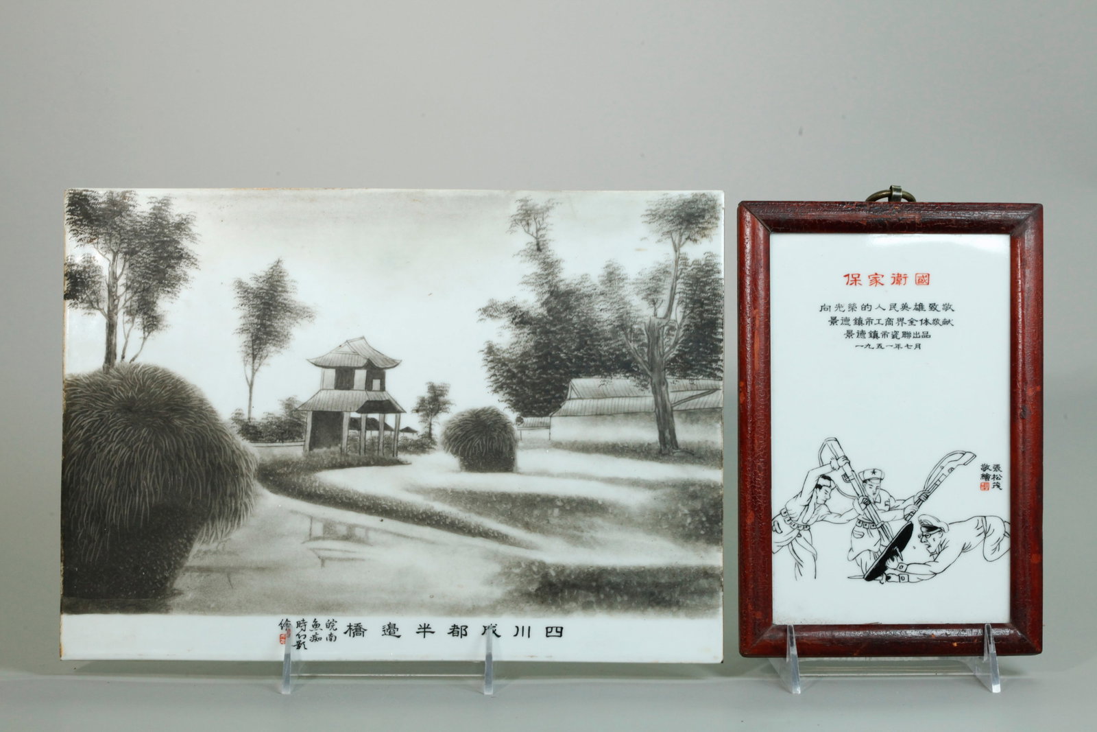 2 Chinese Porcelain Grisaille Enameled Plaques: 2 Chinese Porcelain Grisaille Enameled Plaques: the larger with a view of a Garden Pavilion reflected in a pond with white margin to bottom edge with calligraphy and 1 red seal; together with a Milita