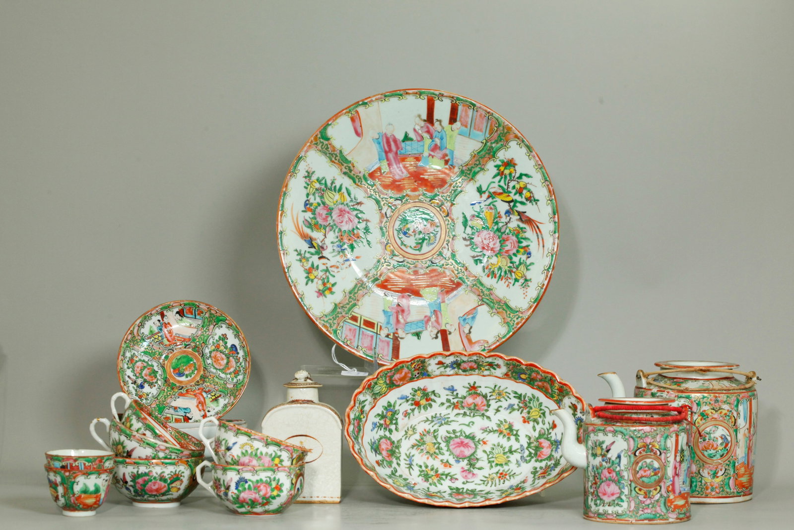16 Chinese Rose Medallion Mandarin Porcelains, Jar: 16 Chinese Rose Medallion Mandarin Porcelains: a round charger plate, an oval bowl, 5 teacups with handle, 2 teabowls without handles, 5 saucers in 3 shapes, a large teapot and a small teapot; togethe