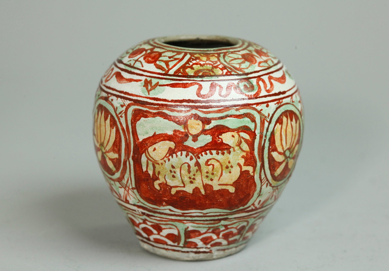 Small Chinese Sancai Painted Stoneware Pot: Small Chinese Sancai Painted Stoneware Water Pot with a Ming-Type design of pairs of animals between Lotus and within decorative bands all in iron red, pale green and pale yellow, the mouth and flat b