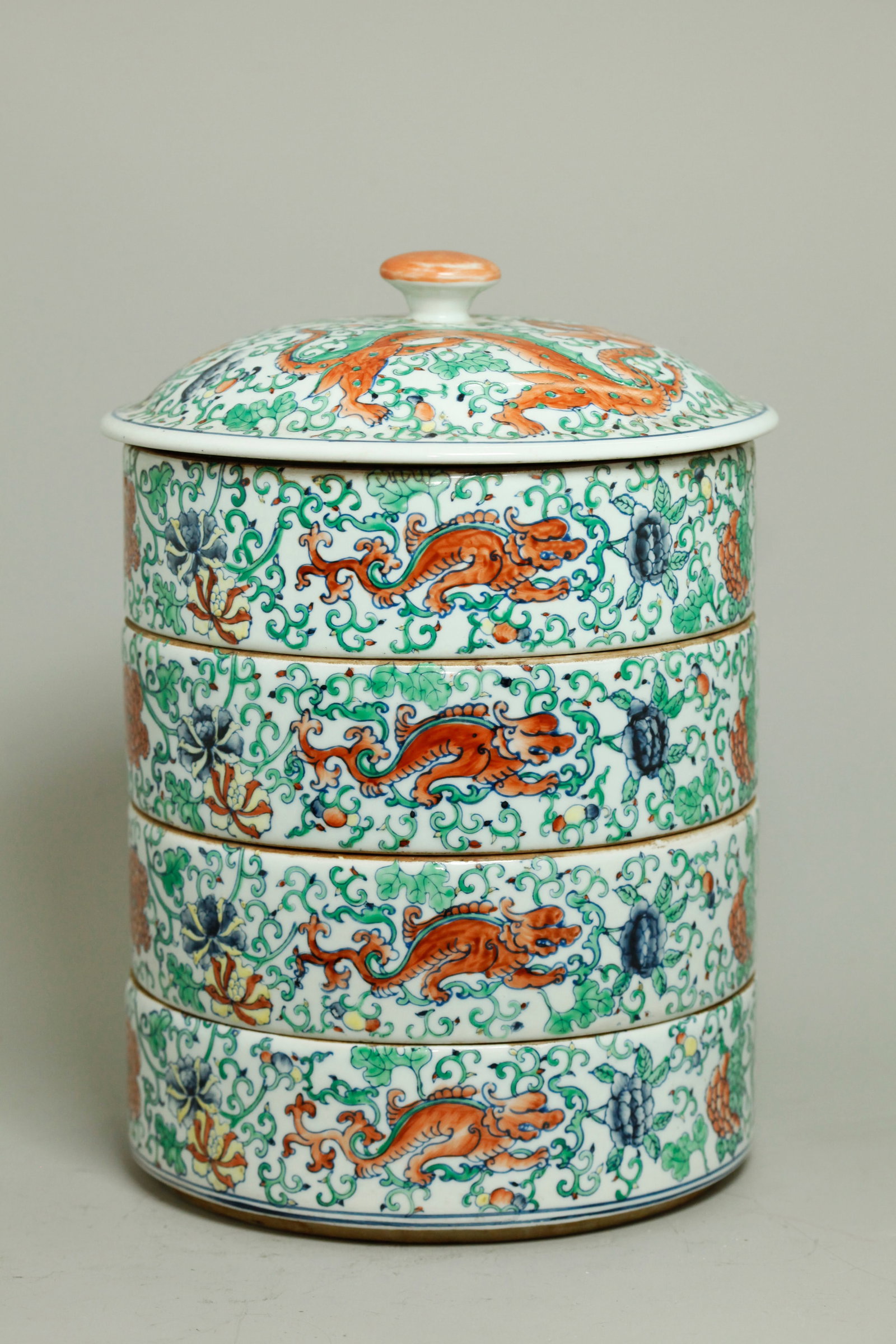 4 Chinese Doucai Porcelain Stacking Round Boxes: 4 Chinese Doucai-type enameled Porcelain Stacking Round Boxes with cover each box in a design of auspicious animals in scrolling leaves and flowers, the base of each with 4 character Kangxi mark in ir