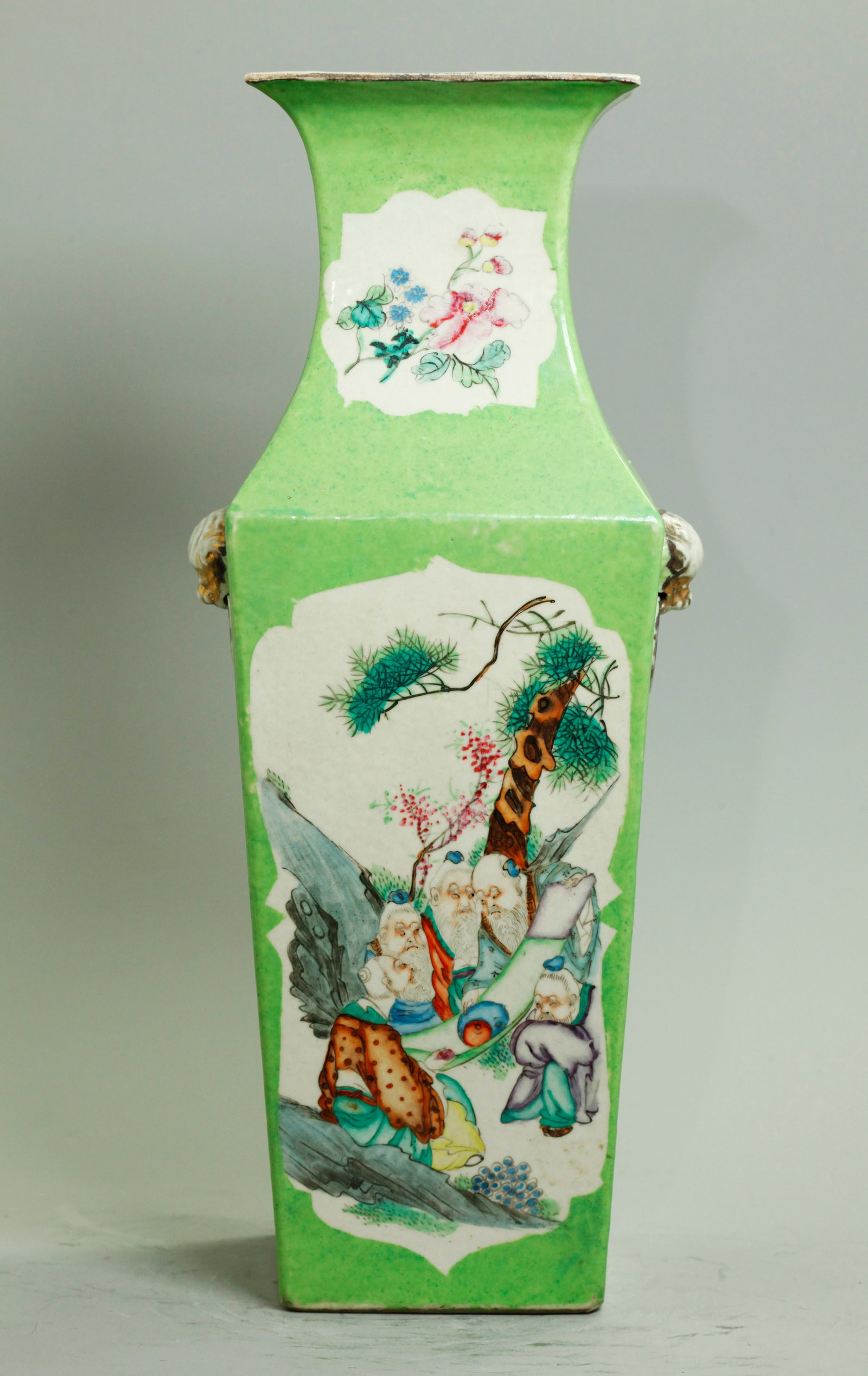 Chinese Enamel Porcelain 4 Side Lime Green Vase: Chinese Enameled Porcelain 4 Sided Lime Green Vase with gilt Lion Head & Ring Handles to the sides, a shaped window to the front with 5 Ancient Daoist Philosophers under a Pine Tree discussing Yinyang