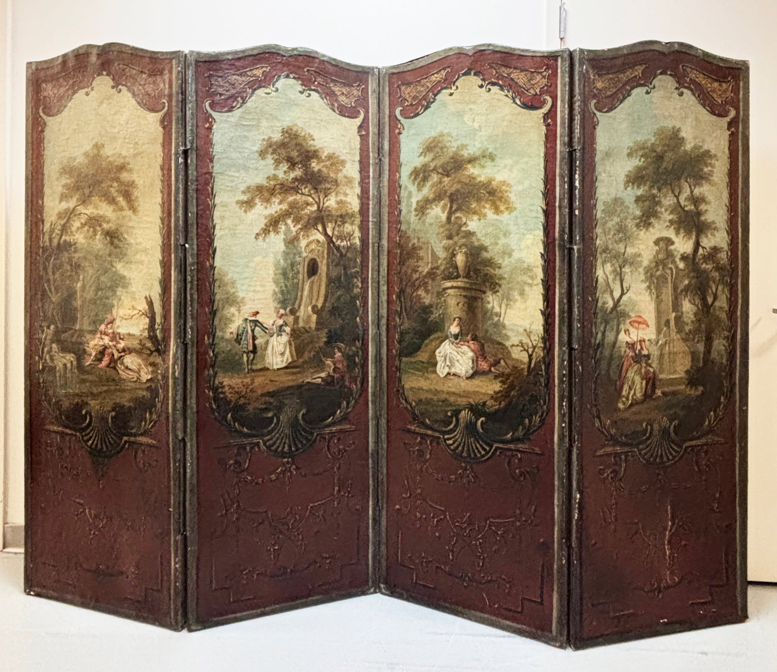 After Lancret; 4 French Oil Canvas Figures Gardens: After Nicolas Lancret (1690-1743); Four 18th Century French Oils on Shaped Canvas with central scenes of Period Figures in lush Gardens with architectural Rococco framing in brown with gilt highlights