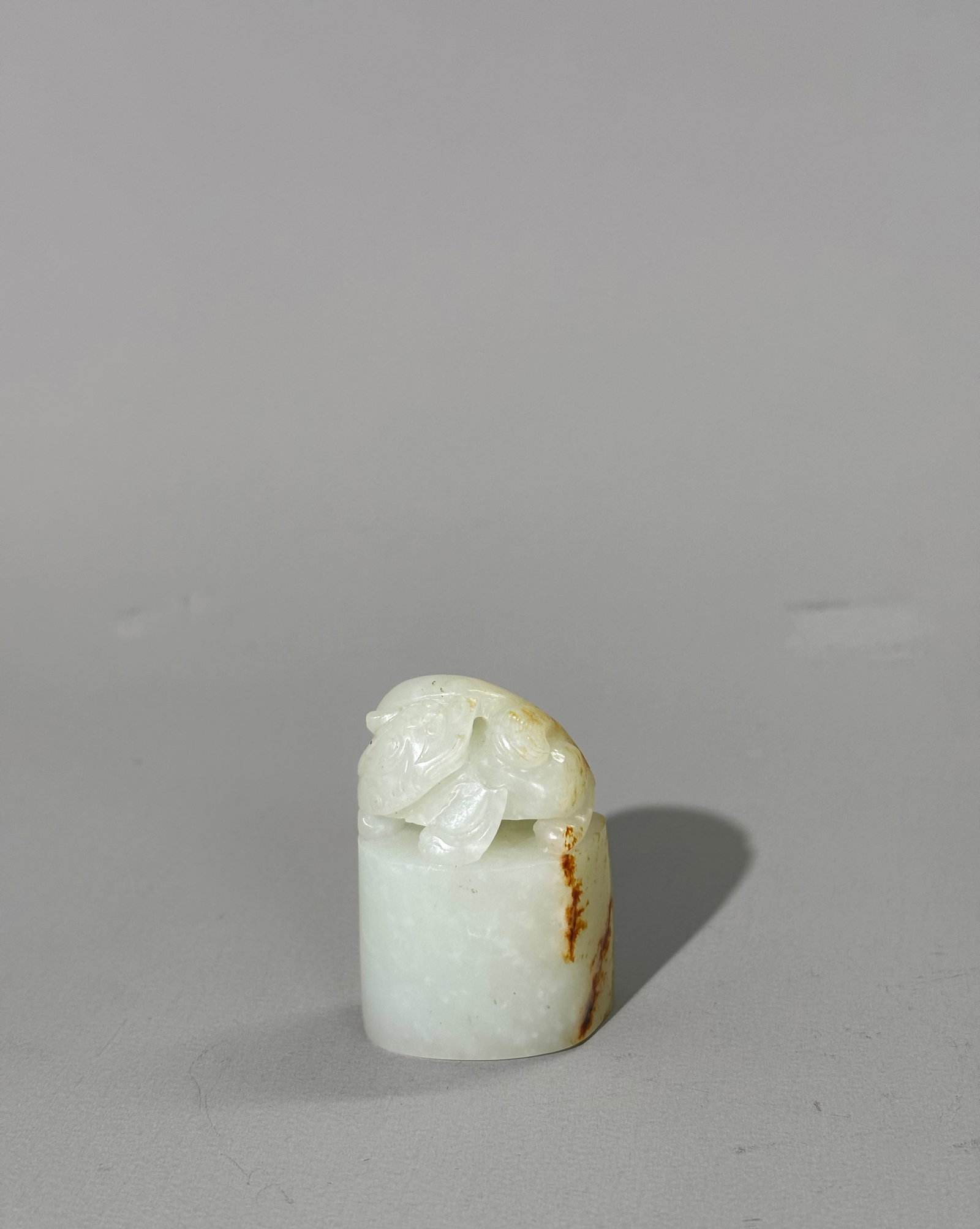 Chinese Qing Warm White & Russet Jade Qilin Seal: Chinese Qing Warm White & Russet Skin Jade Qilin Seal, the seal face polished not carved, the animal with abundant double tail and single horn. Height 1 3/4 inches X width 1 1/4 inches. NOTE: With old