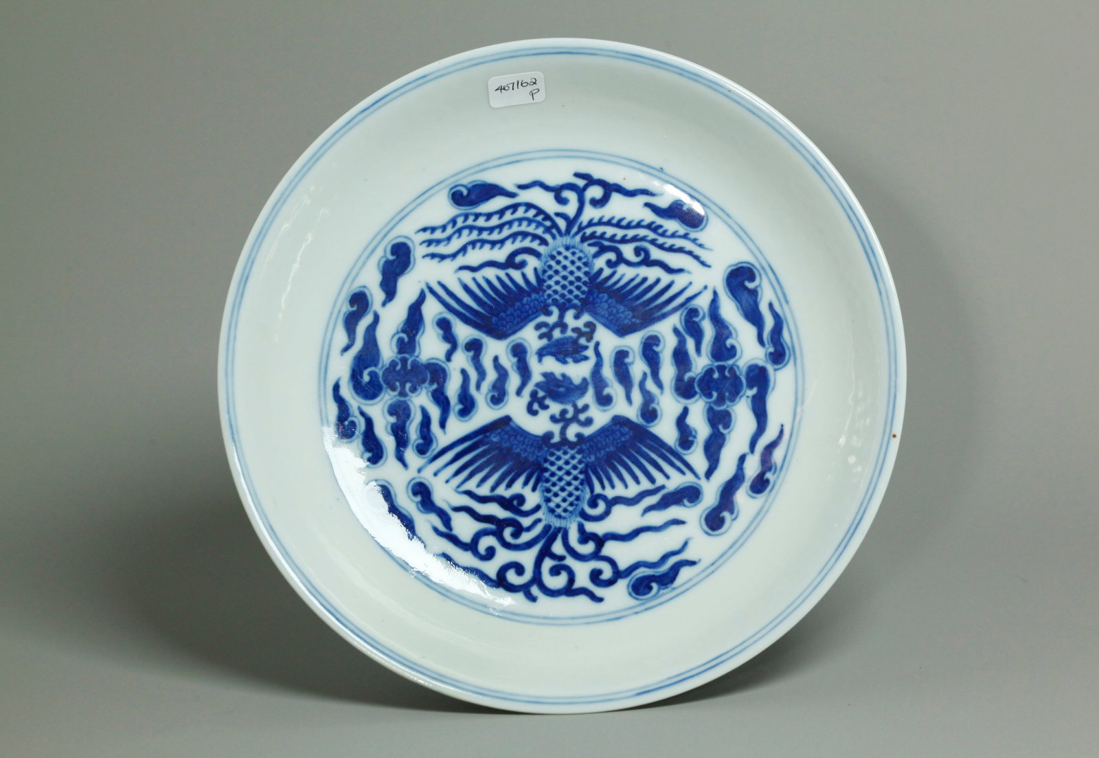 Chinese Guangxu Blue White Porcelain Phoenix Plate: Chinese Blue & White Porcelain Double Phoenix Birds in Clouds Plate with a center medallion of 2 Phoenix and 2 Phoenix to underside cavetto edge, the base in clear gaze with 6 character Guangxu mark a
